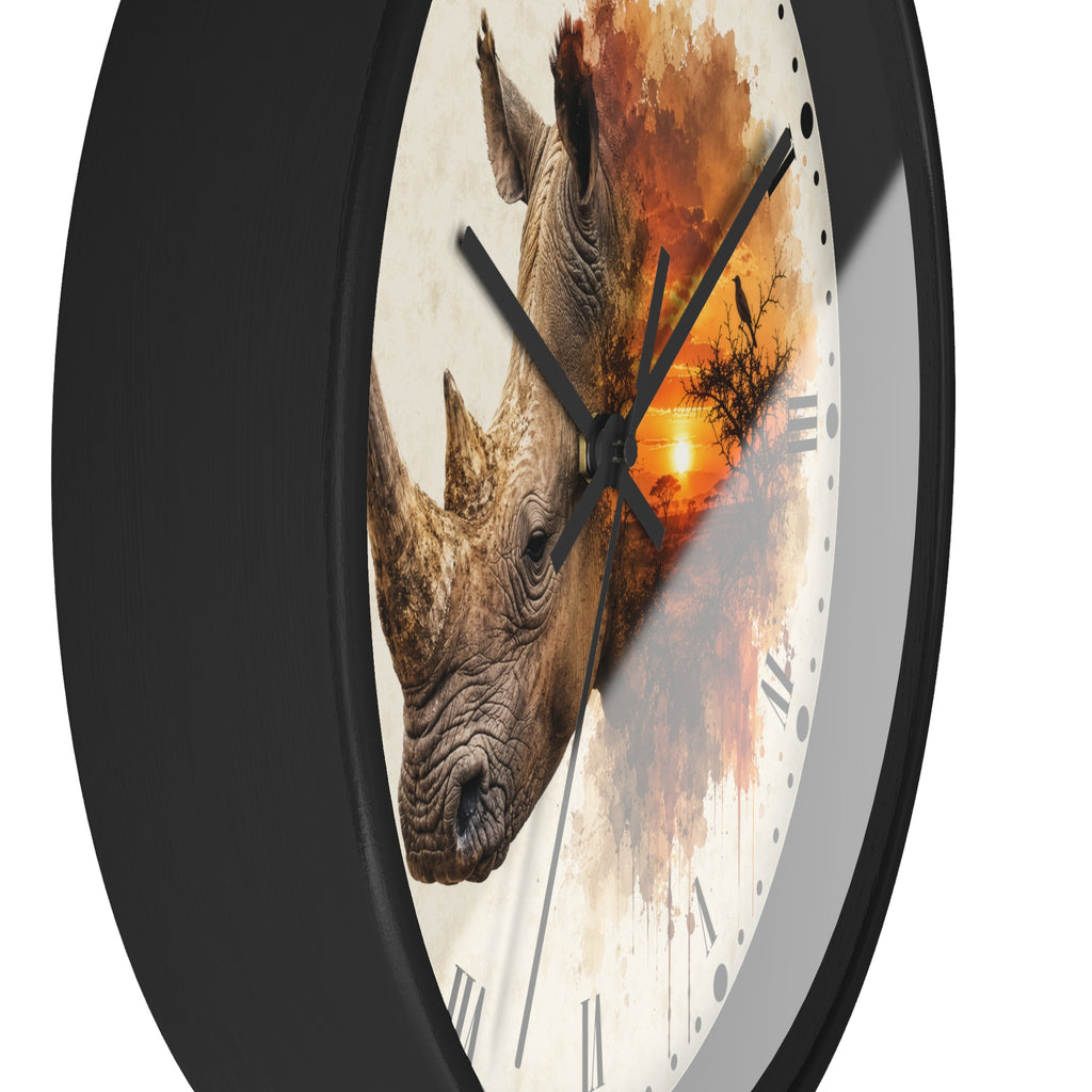A round wall clock with a black frame and a printed dial featuring a rhinoceros head over an orange sunset scene on a white background.