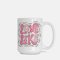 White mug with pink text 'LOVE LIKE' on a white background