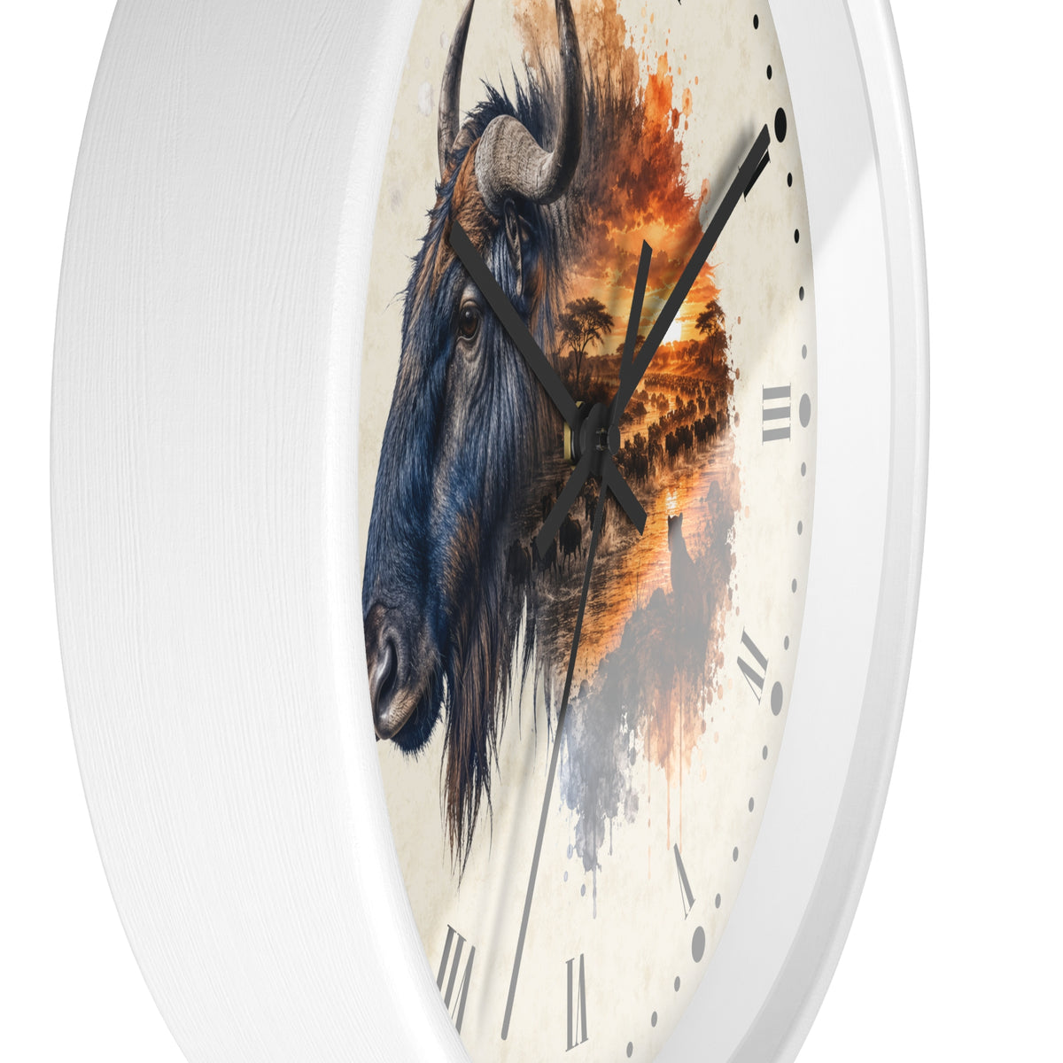 A round wall clock with a white frame and a printed face featuring a blue-gray wildebeest head merging into an orange sunset landscape, with black Roman numerals and black hands.