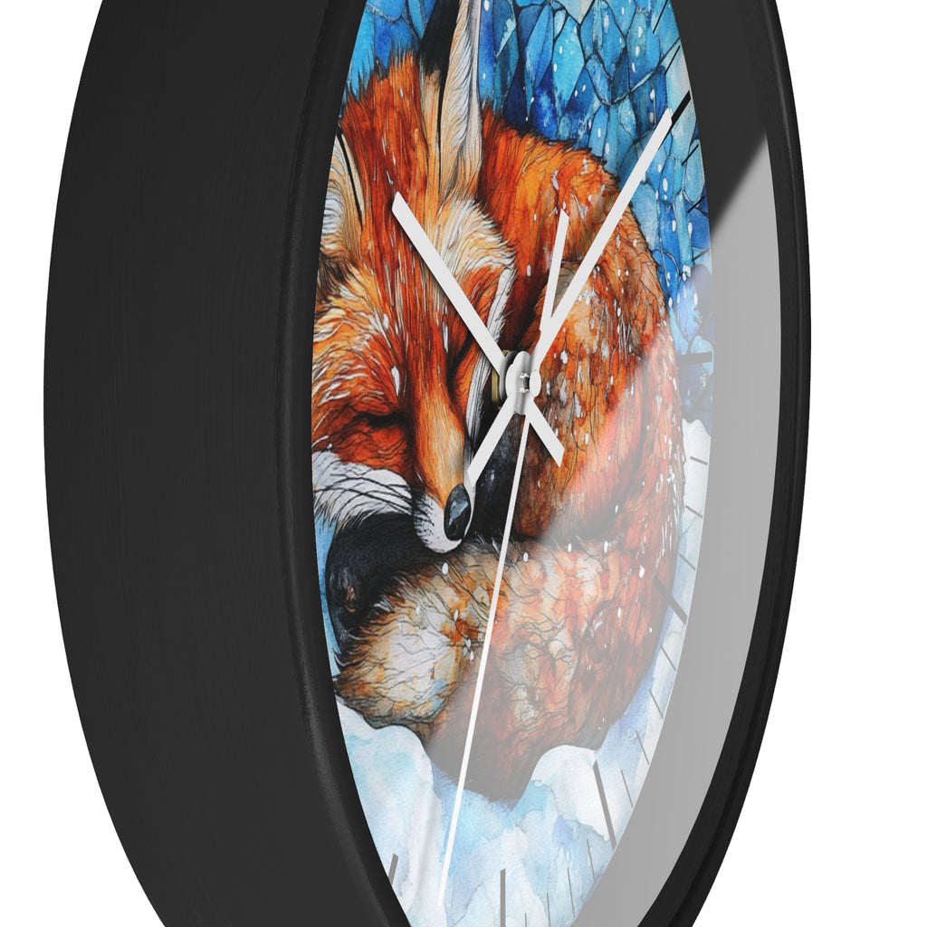 A close-up of a round wall clock with a black frame and a printed illustration of a sleeping fox in warm orange-brown tones against a blue and white background.