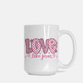White mug with pink 'Love like Jesus' text on a white background