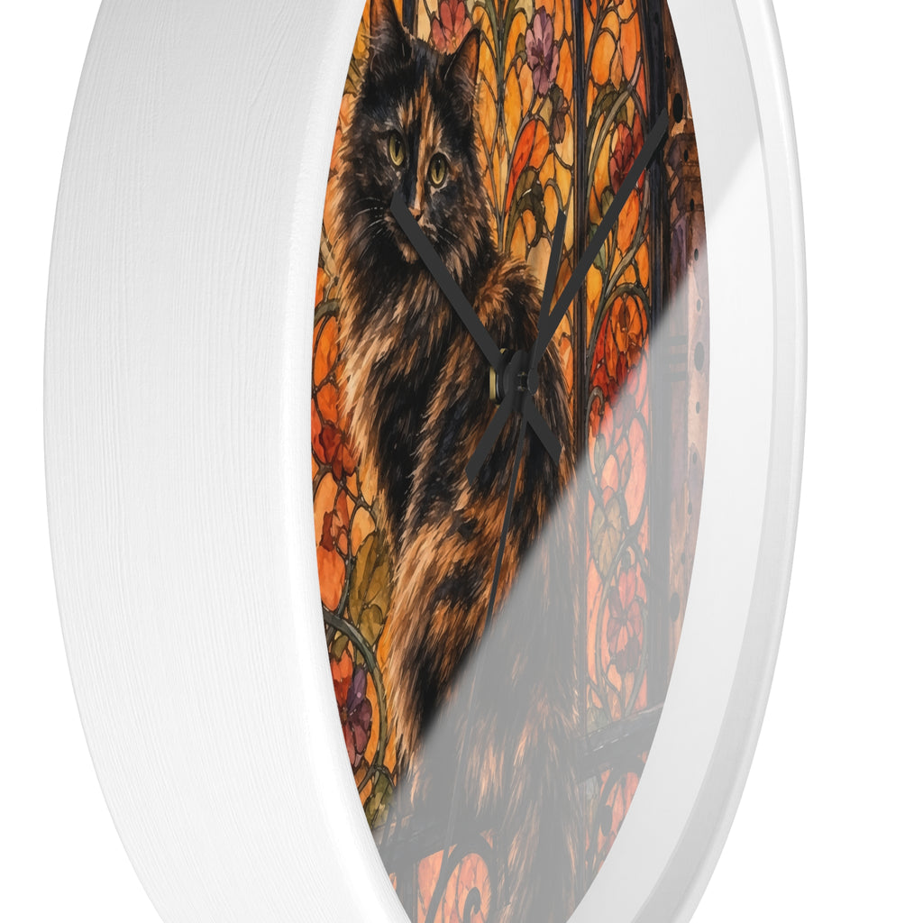 Round wall clock with a white frame and a printed cat artwork in warm autumn colors, shown against a plain white background.