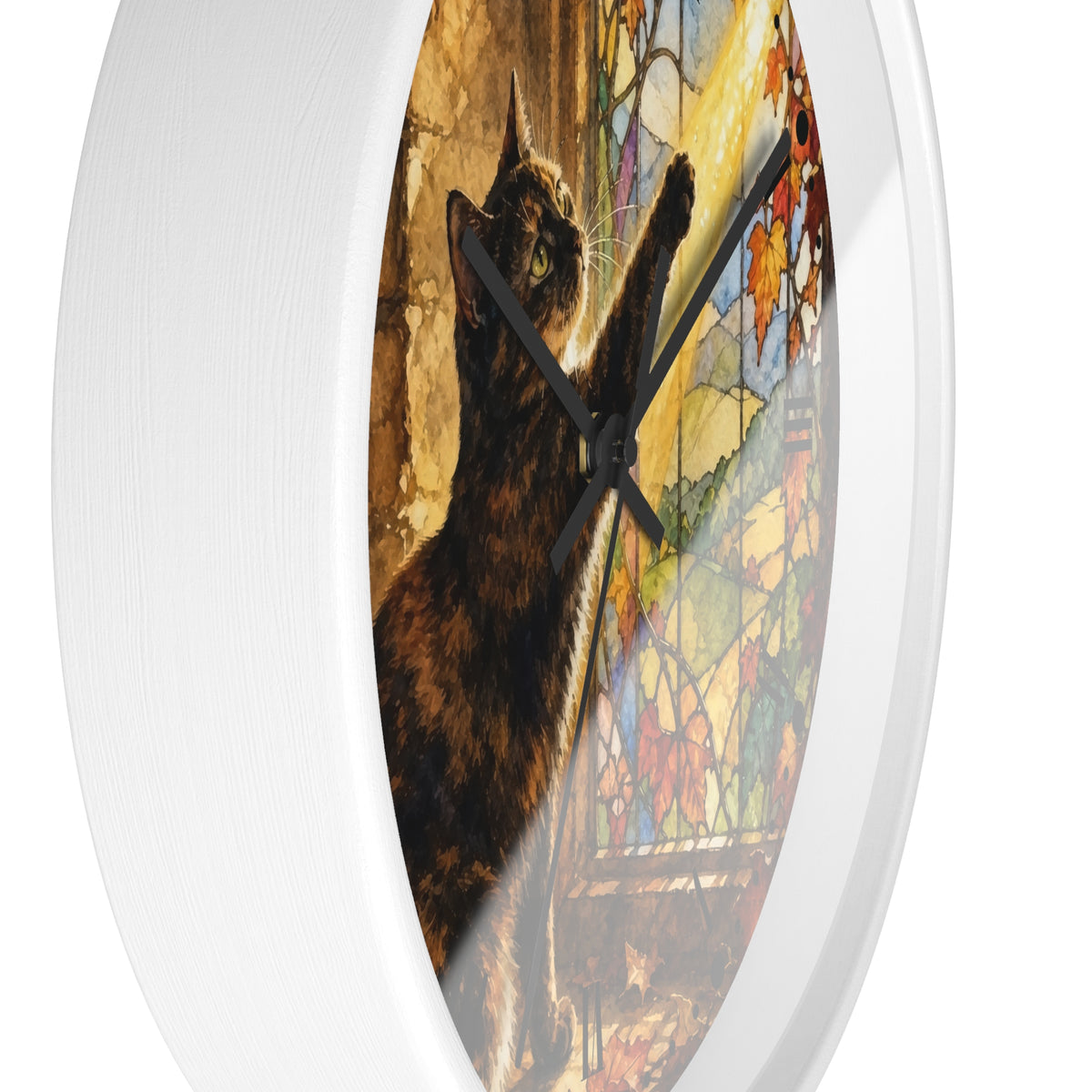 A white round wall clock with a printed cat artwork on the face. The design shows a dark brown cat in front of a colorful stained-glass window, with black clock hands.