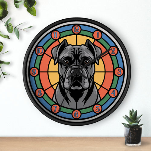 Wall clock with a cane Corso dog illustration on a colorful circular design, placed on a white wall with a plant and small pot in the background.