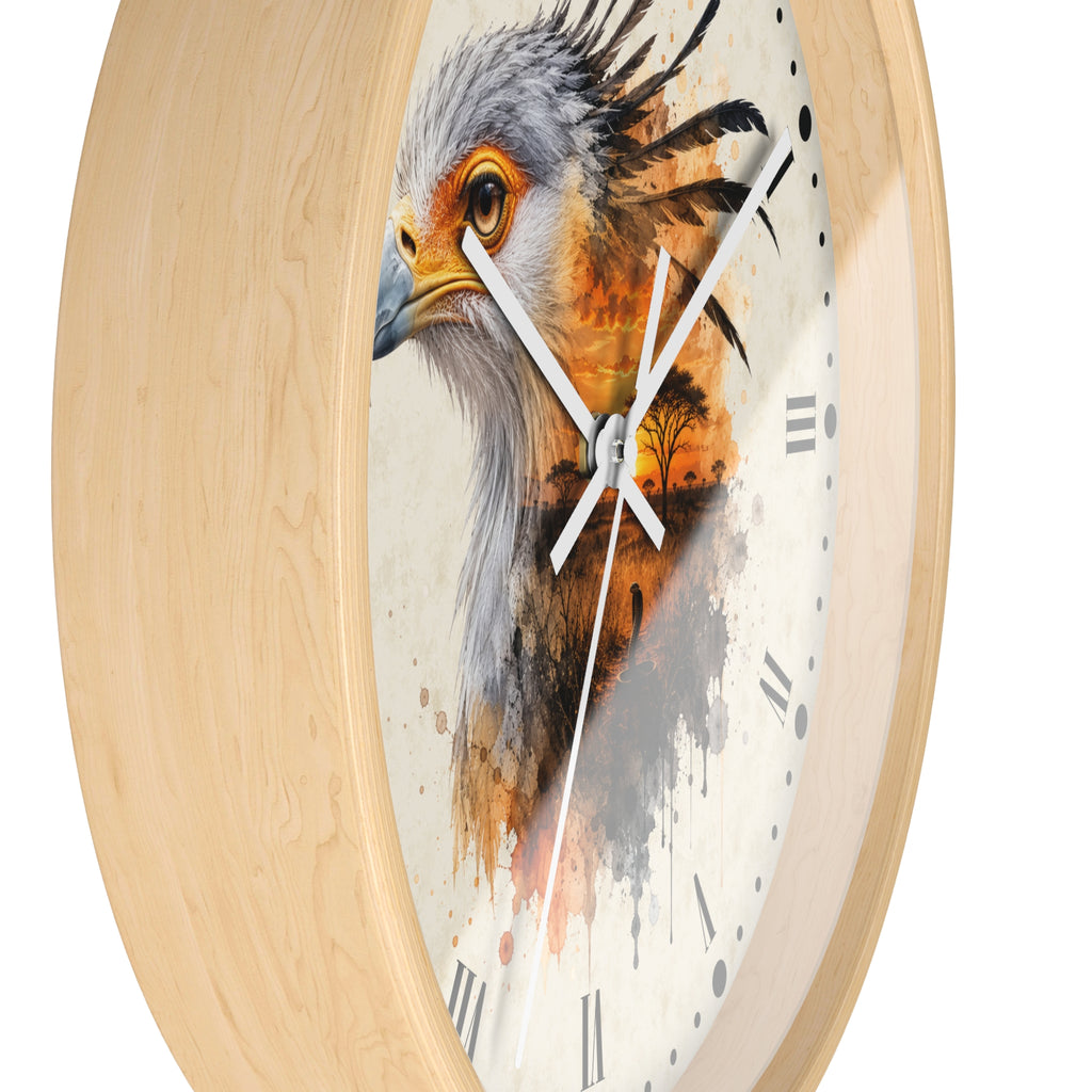 Oval wall clock with a light natural wood frame and a printed bird face design on the face. The clock has white hands, black Roman numerals, and a watercolor-style bird illustration in gray, white, orange, and brown tones.