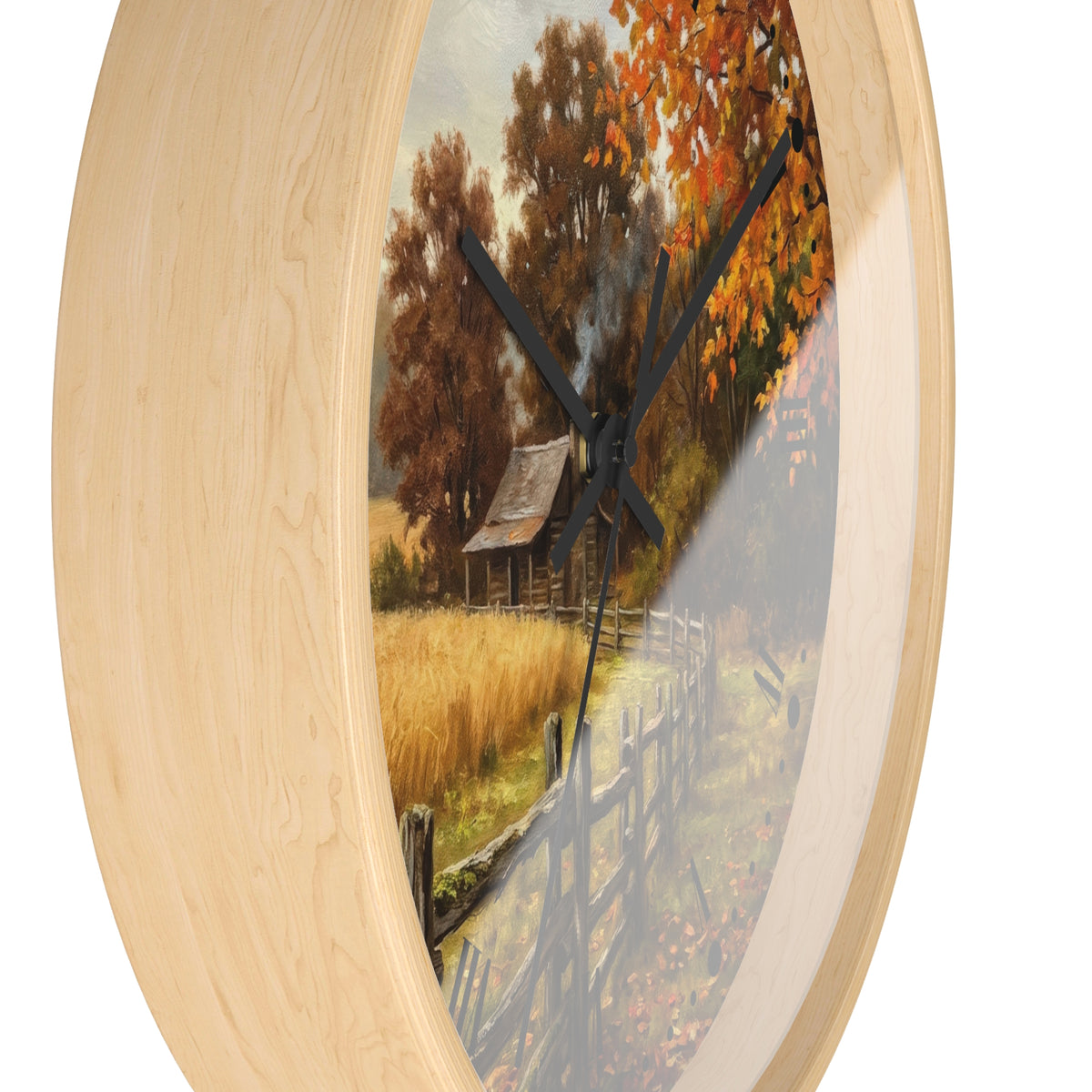 Round wall clock with a light natural wood frame and a scenic autumn landscape print featuring orange trees, a small cabin, and a fence, shown against a white background.