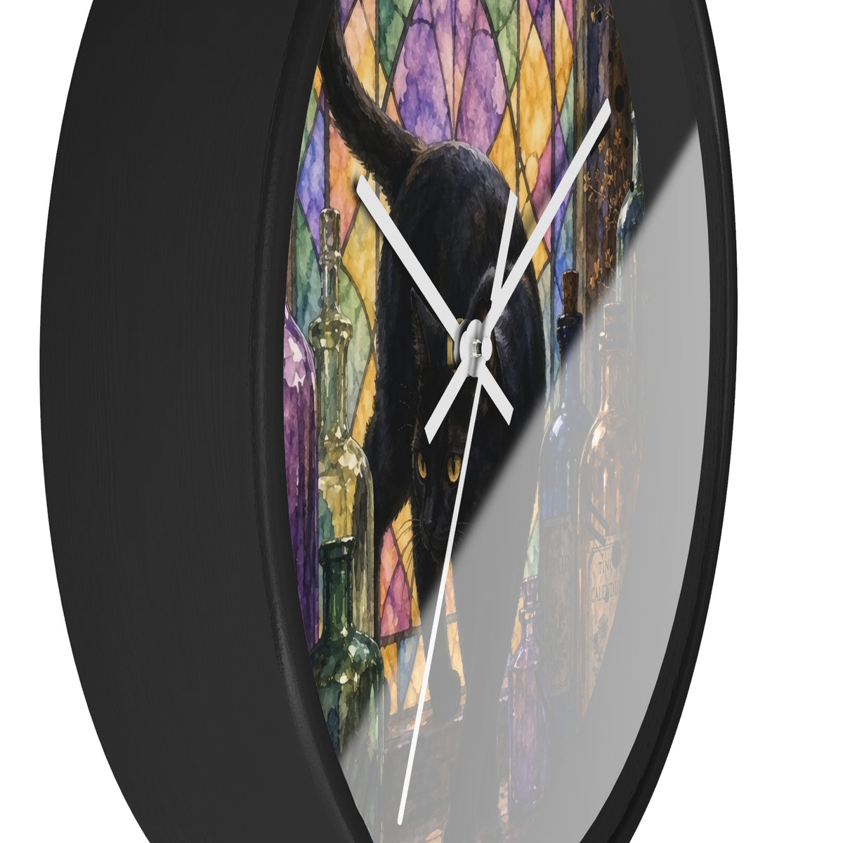 A round wall clock with a black frame and white hands, featuring a printed design of a black cat in front of a colorful stained-glass style background with purple, yellow, and blue panels.