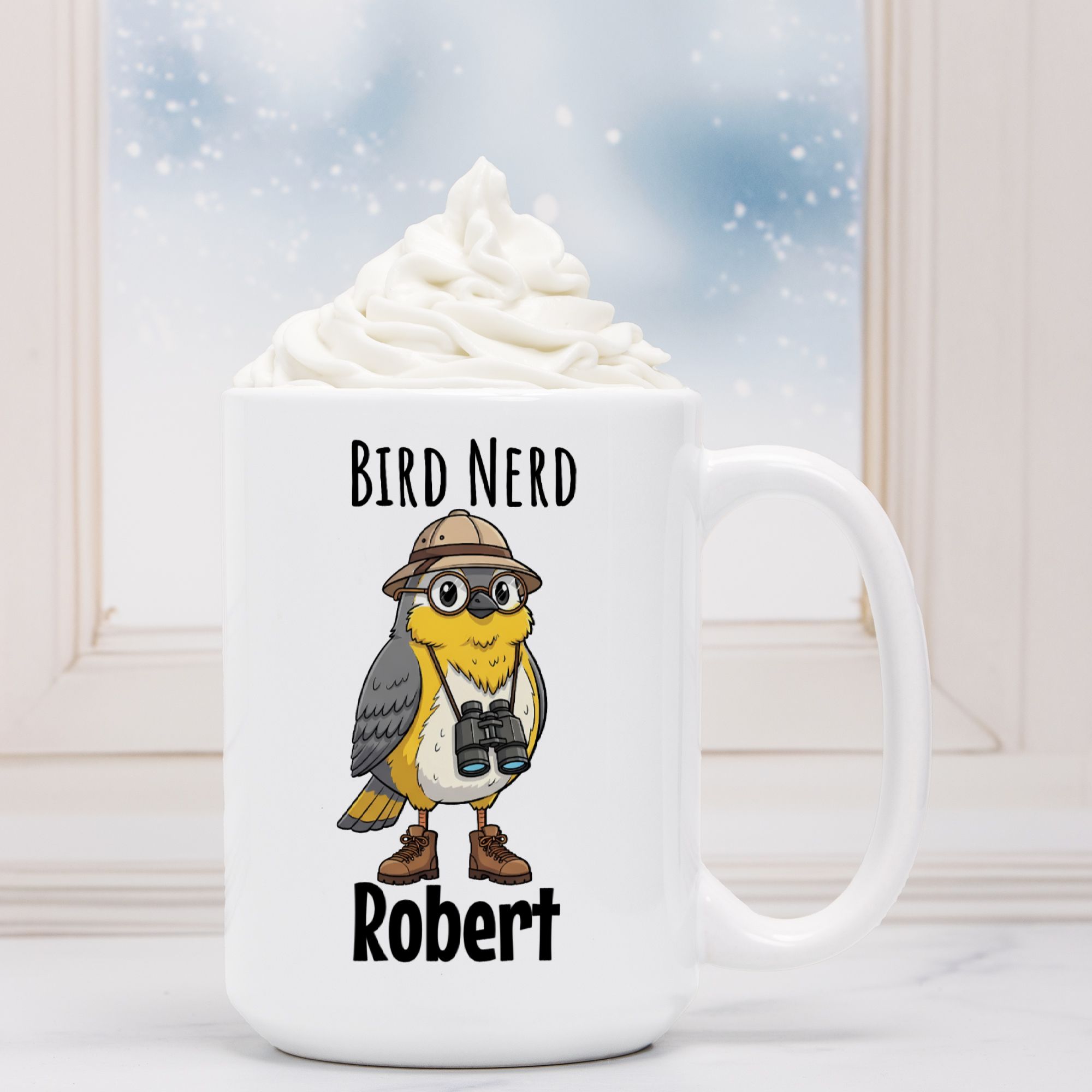 White mug with a bird design and 'Bird Nerd Robert' text, filled with hot chocolate.