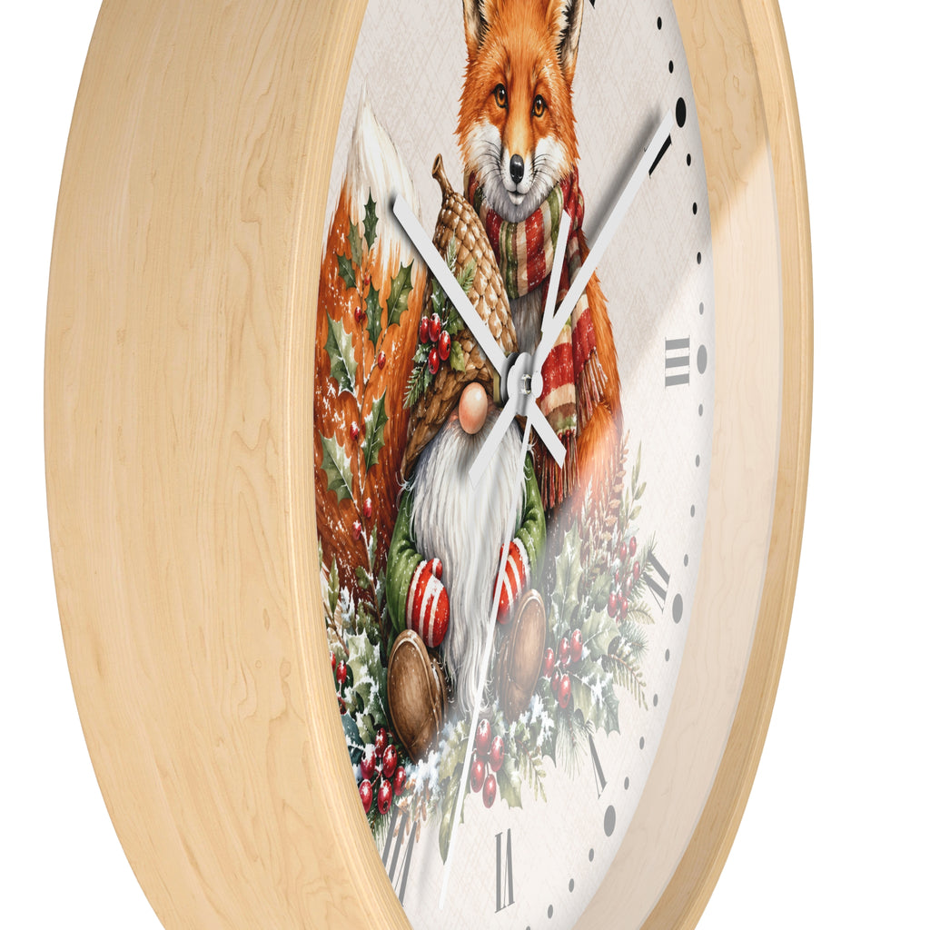 Round wall clock with a light natural wood frame and a white face featuring a festive illustration of a fox in a red scarf surrounded by holiday greenery and candy canes.