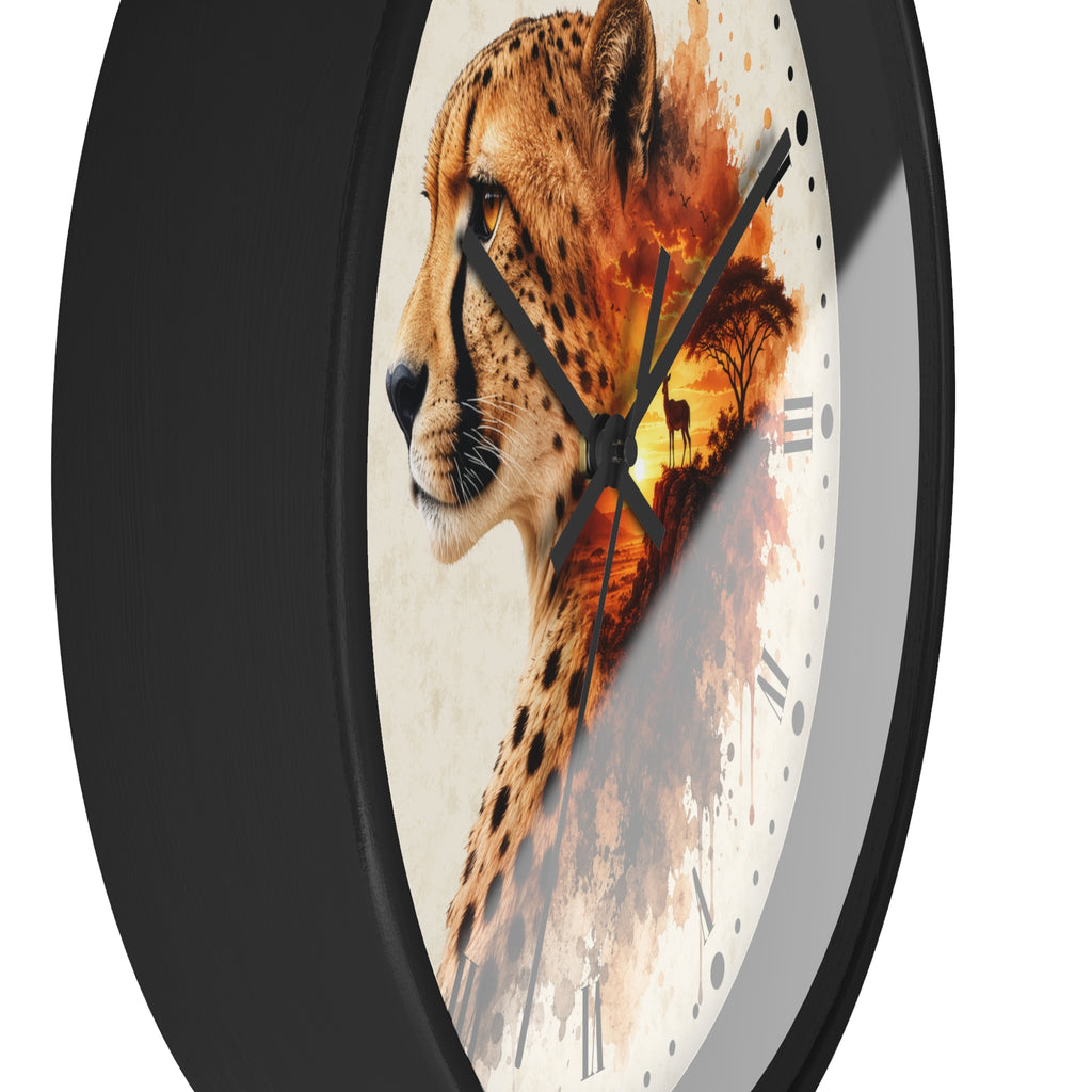 A round wall clock with a black frame and a printed face featuring a cheetah profile blending into an orange-toned landscape scene. The clock is shown at an angle against a plain white background.
