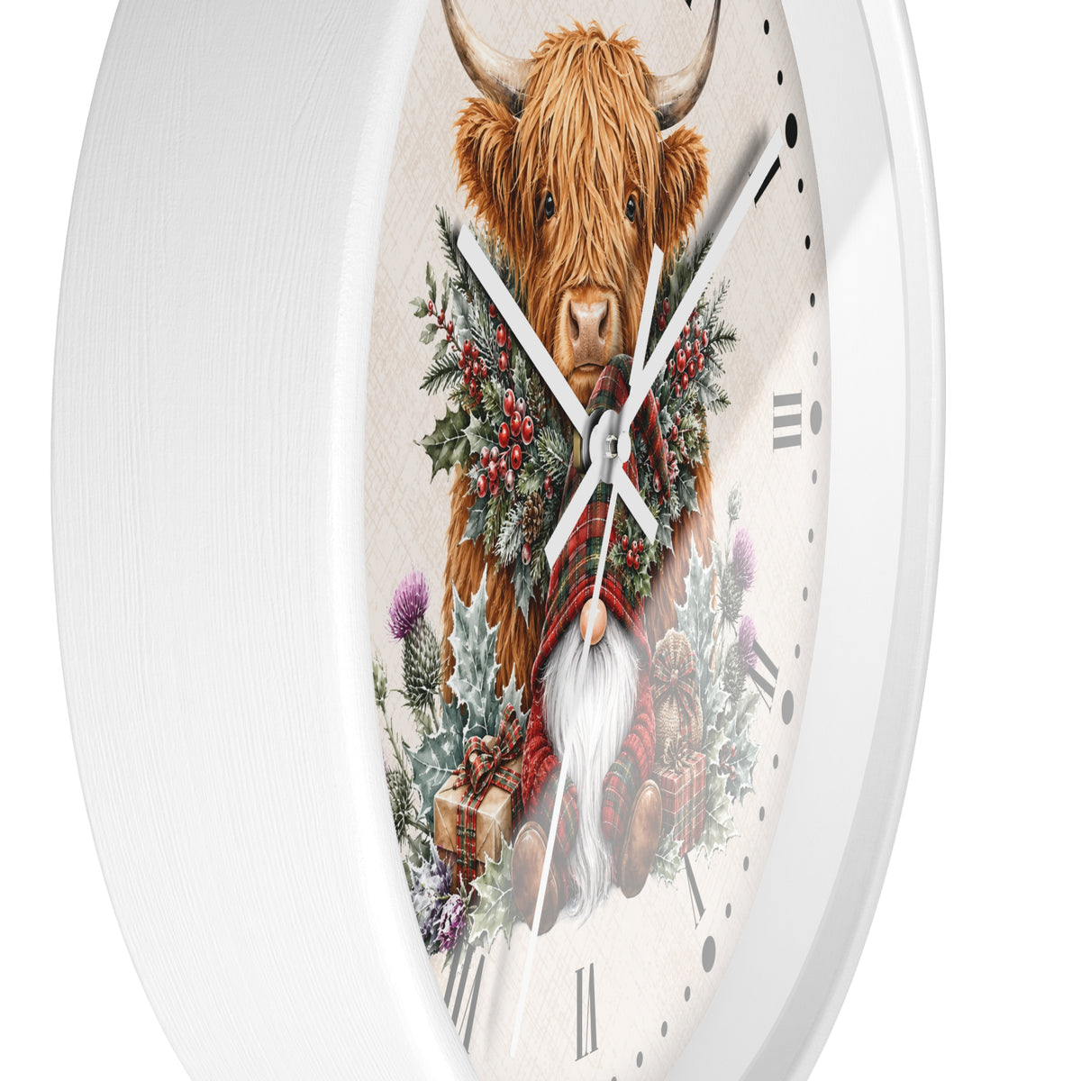A white round wall clock featuring a detailed illustration of a Highland cow surrounded by a green and red winter wreath, set against a clean white background.
