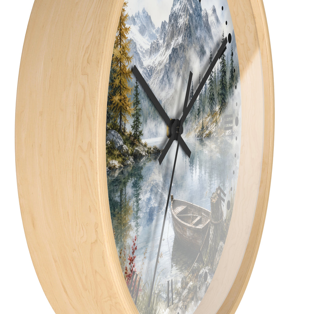 Round wall clock with a light natural wood frame and a scenic print of a mountain lake landscape featuring pine trees, a boat, and a small cabin.