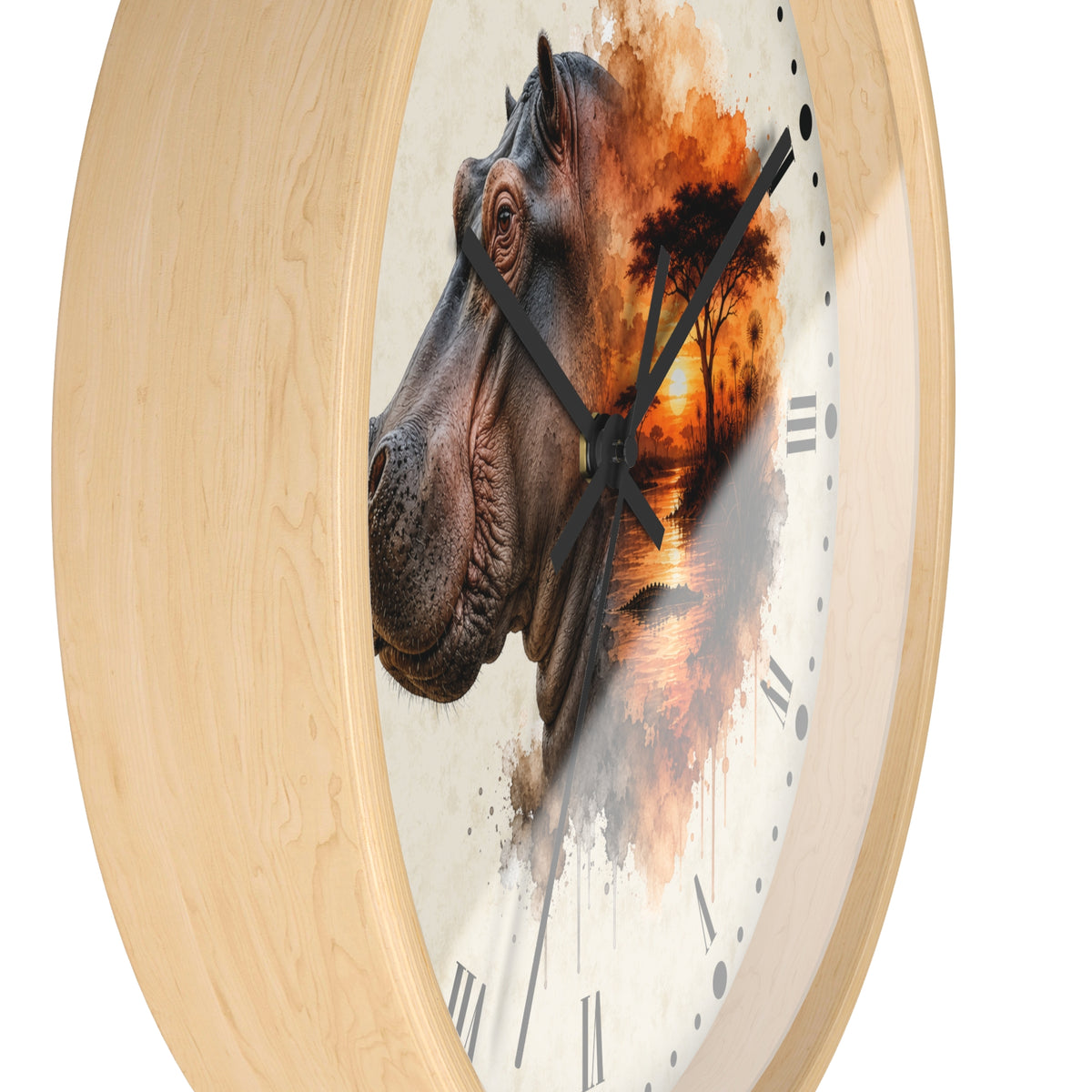 A round wall clock with a light natural wood frame and a printed face featuring a hippopotamus head overlaid with an orange sunset landscape scene, shown on a white background.