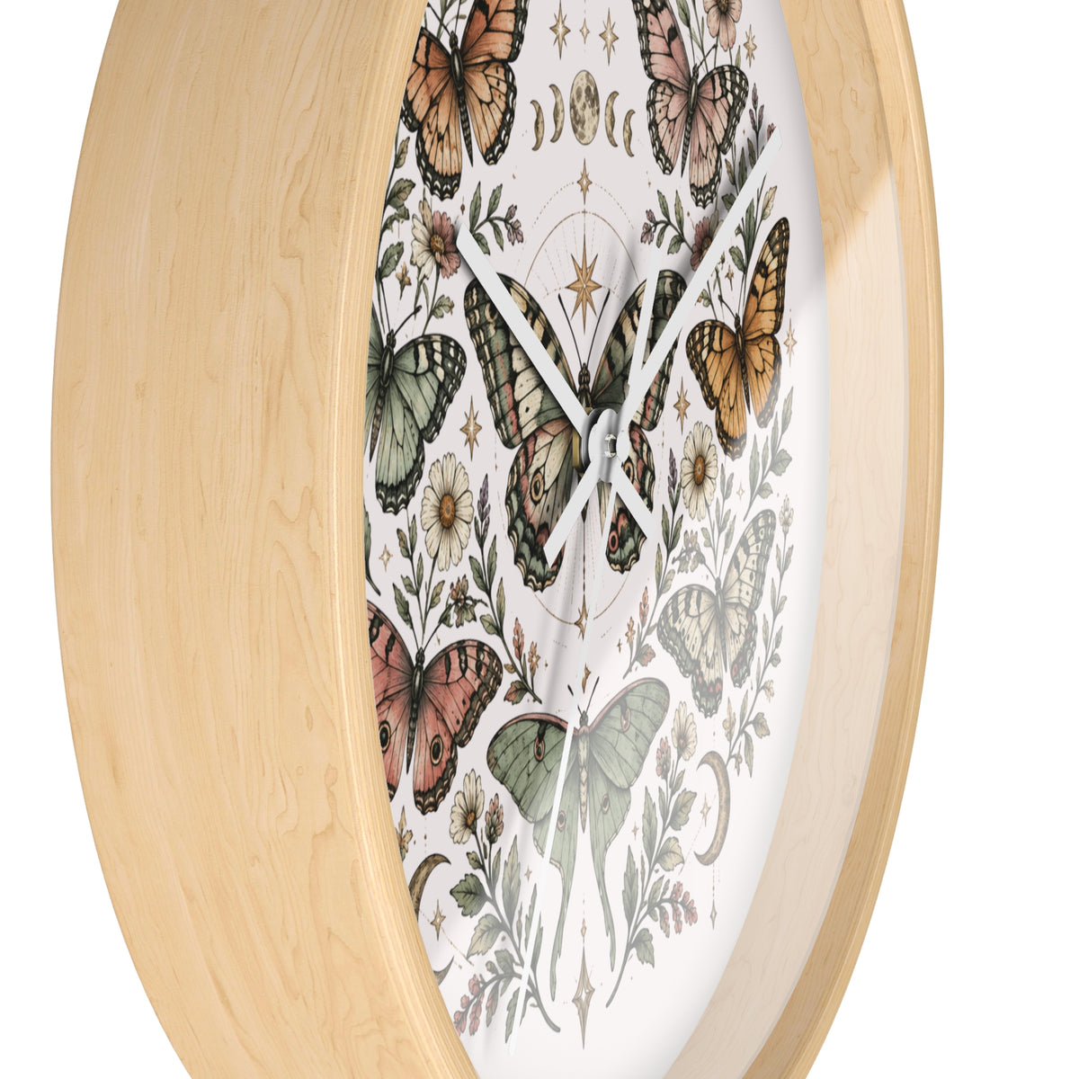 A close-up of a round wall clock with a light natural wood frame and a white dial decorated with vintage-style butterflies and botanical illustrations.