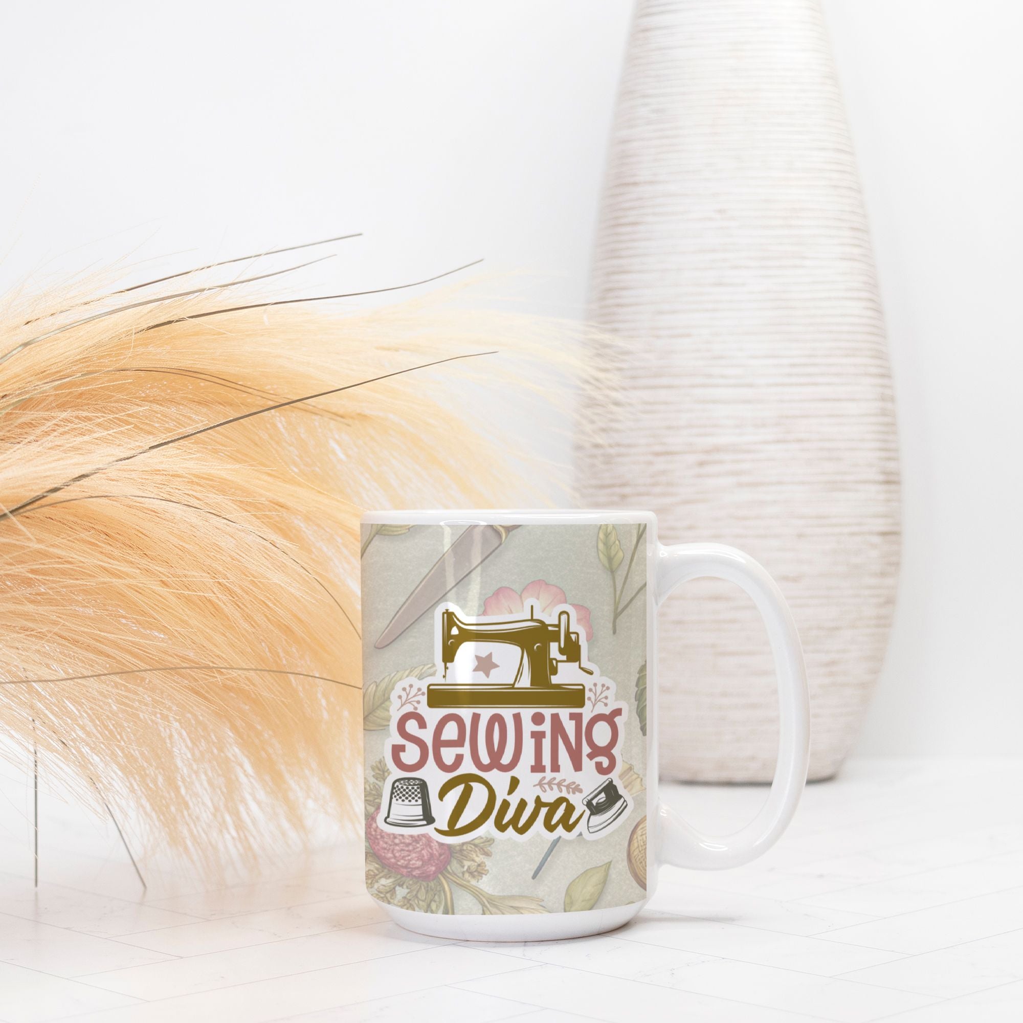 Mug with 'Sewing Diva' design on a white surface with decorative elements