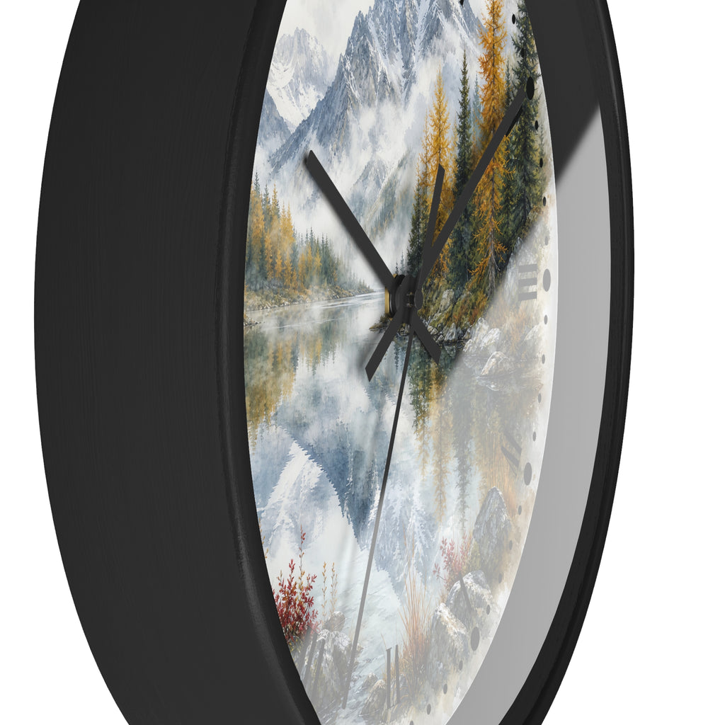 Round wall clock with a black frame and a scenic landscape print featuring snowy mountains, a reflective lake, evergreen trees, and autumn foliage.