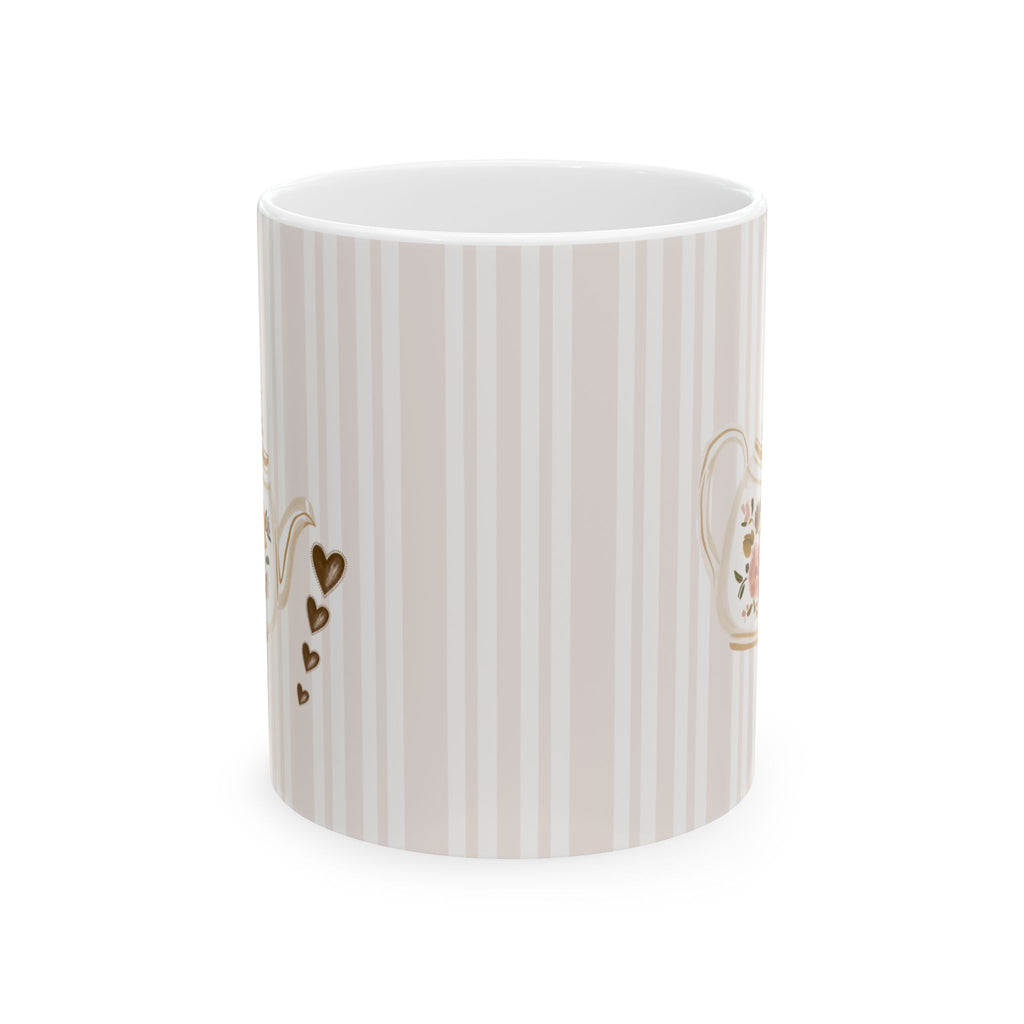A white ceramic mug featuring vertical beige stripes and delicate gold floral and heart motifs, shown on a clean white background.