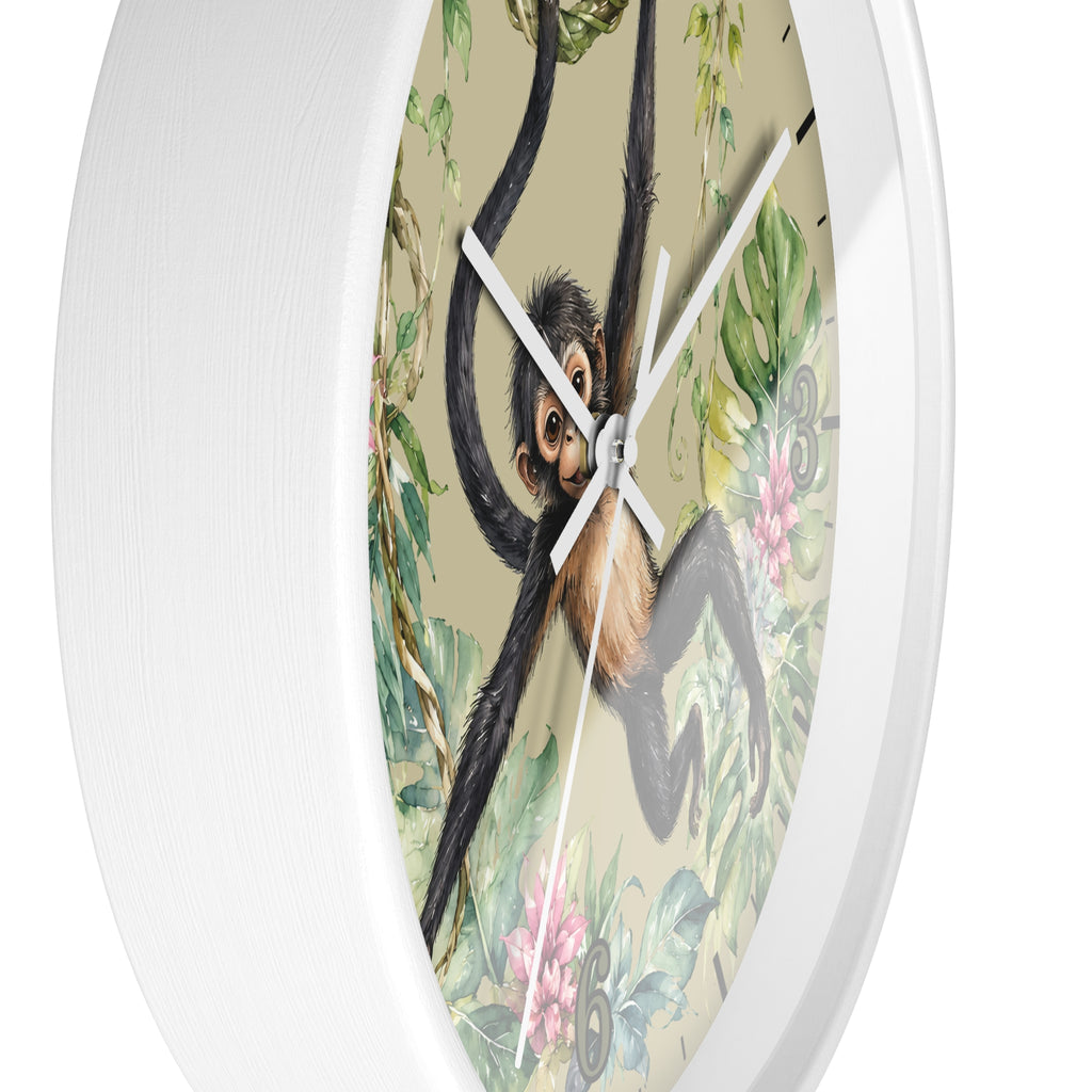 A round wall clock with a white frame and a vintage-style illustration of a chimpanzee hanging in a jungle, featuring green leaves, pink flowers, and beige background.