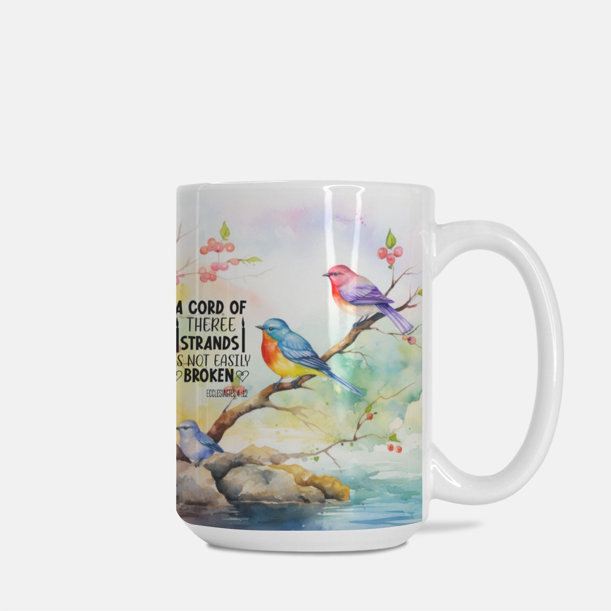 Mug with colorful birds on a branch design and text on a white background