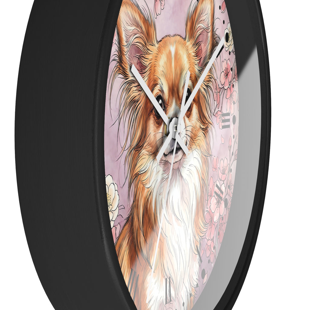 A round wall clock with a black frame and a printed illustration of a fluffy long-haired dog on a pink background, shown against a plain white backdrop.