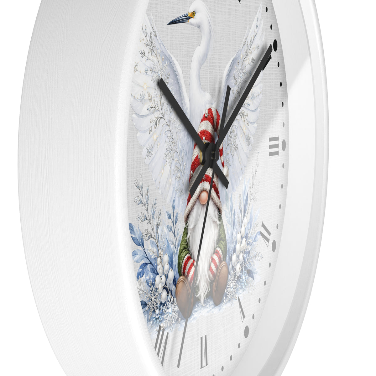 A round white wall clock with a festive illustration of a white heron and a Santa-clad gnome surrounded by blue winter foliage on the face.
