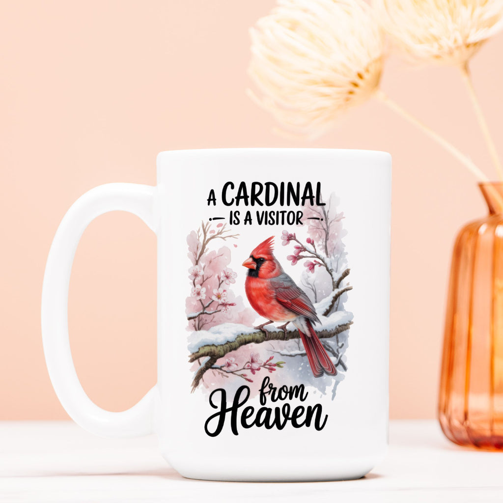 White mug with a cardinal design and text on a light pink background