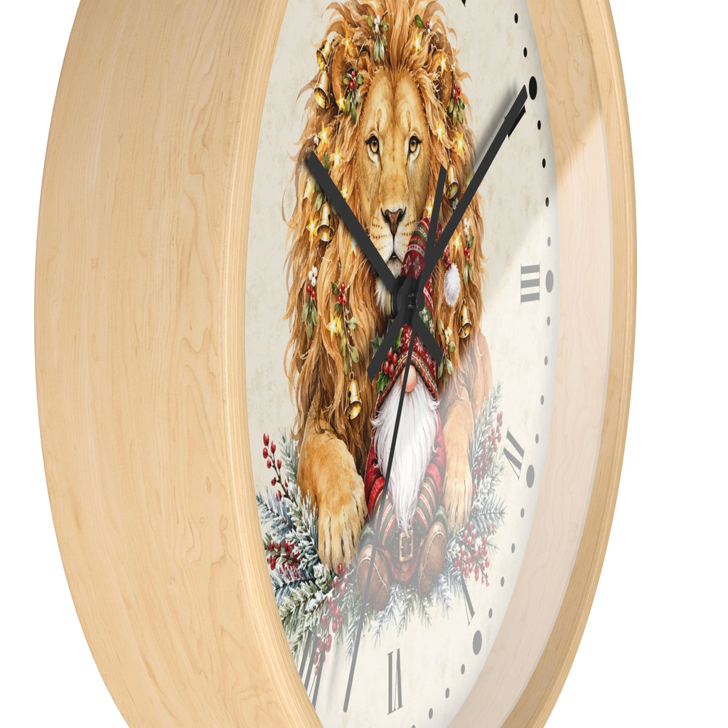 A round wall clock with a light natural wood frame and a festive printed face showing a lion wearing a Christmas wreath and Santa hat, on a white background.