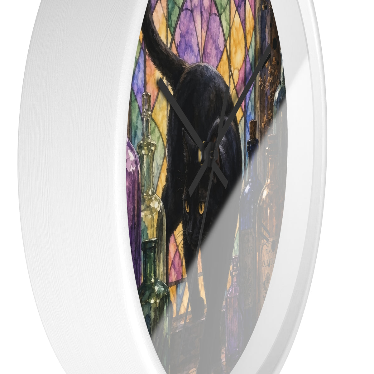 Round wall clock with a white frame and a printed design of a black cat in front of a colorful stained-glass window, shown against a plain white background.