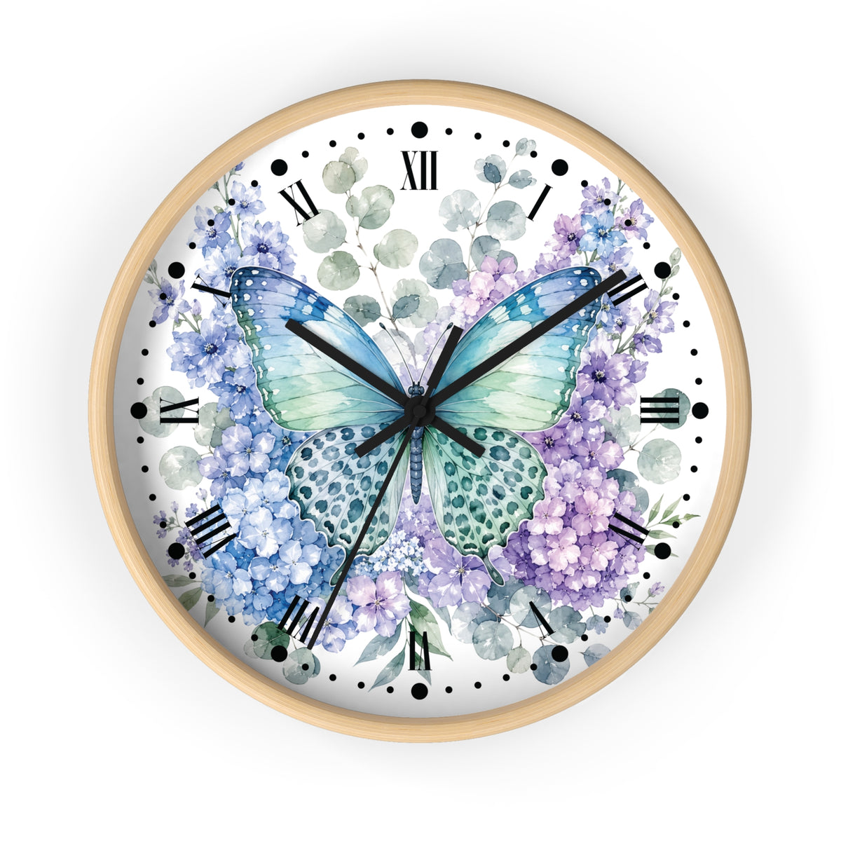 A round wall clock with a light natural wood frame, featuring a white dial decorated with a watercolor-style blue and green butterfly surrounded by purple and blue hydrangea flowers, Roman numerals, and black hands.