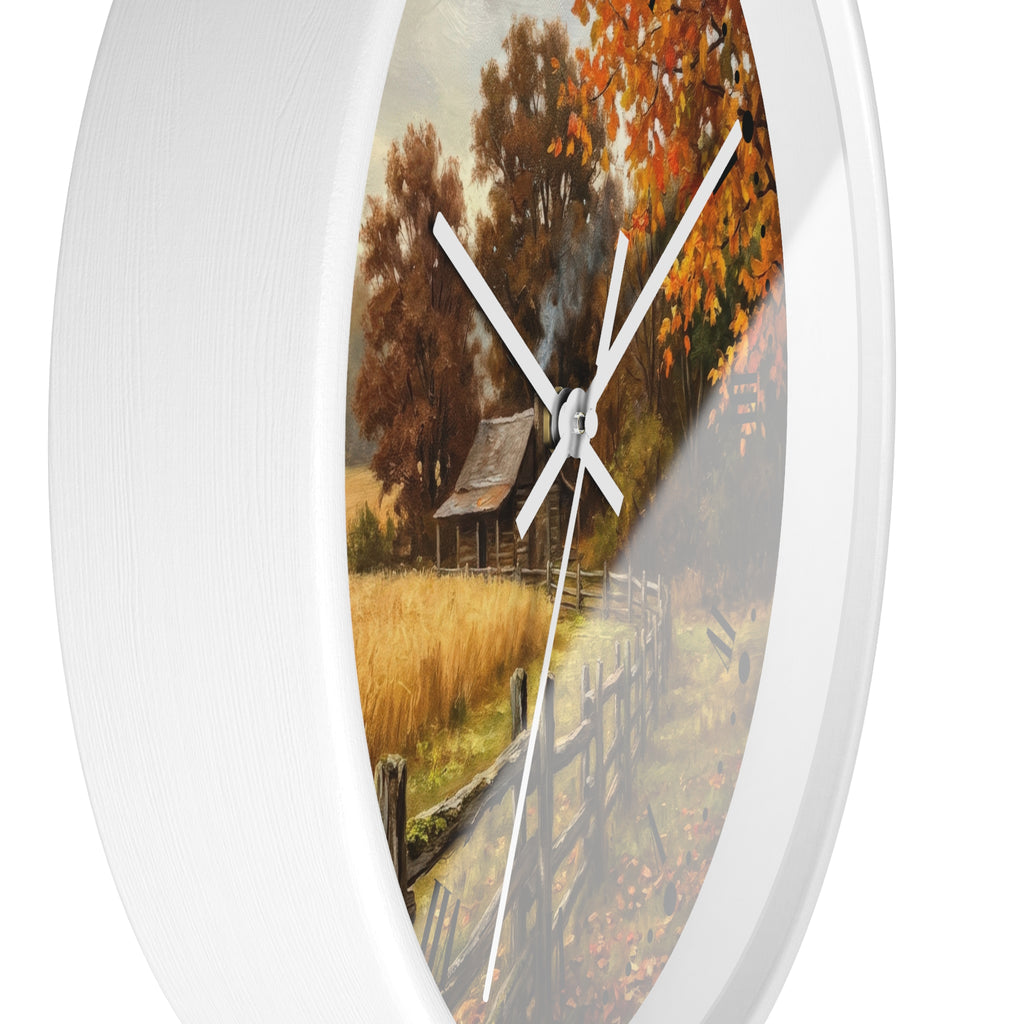 Round wall clock with a white frame and a printed autumn landscape design featuring trees, a cabin, and a fence.
