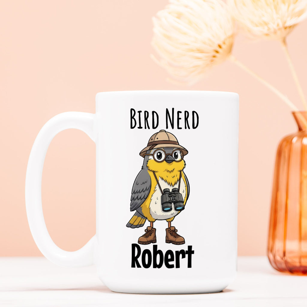 White mug with a bird graphic and text 'Bird Nerd Robert' on a light pink background