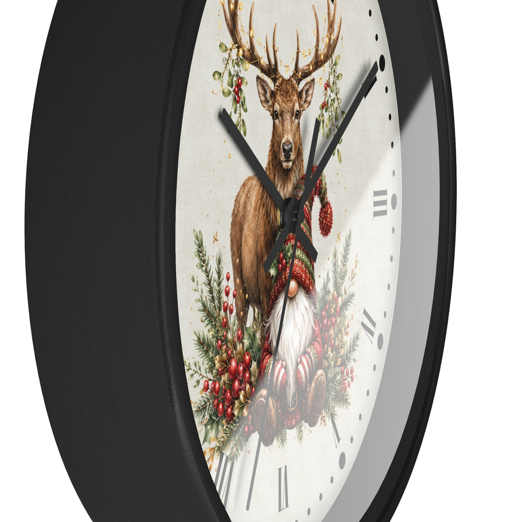 A round wall clock with a black frame and a white clock face featuring a festive illustration of a deer, a gnome, and red berries.