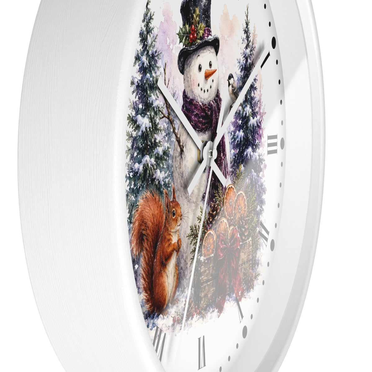 A white round wall clock with a winter woodland illustration on the face, featuring a snowman in a top hat, a squirrel, evergreen trees, and a small bird, with white clock hands and Roman numerals.