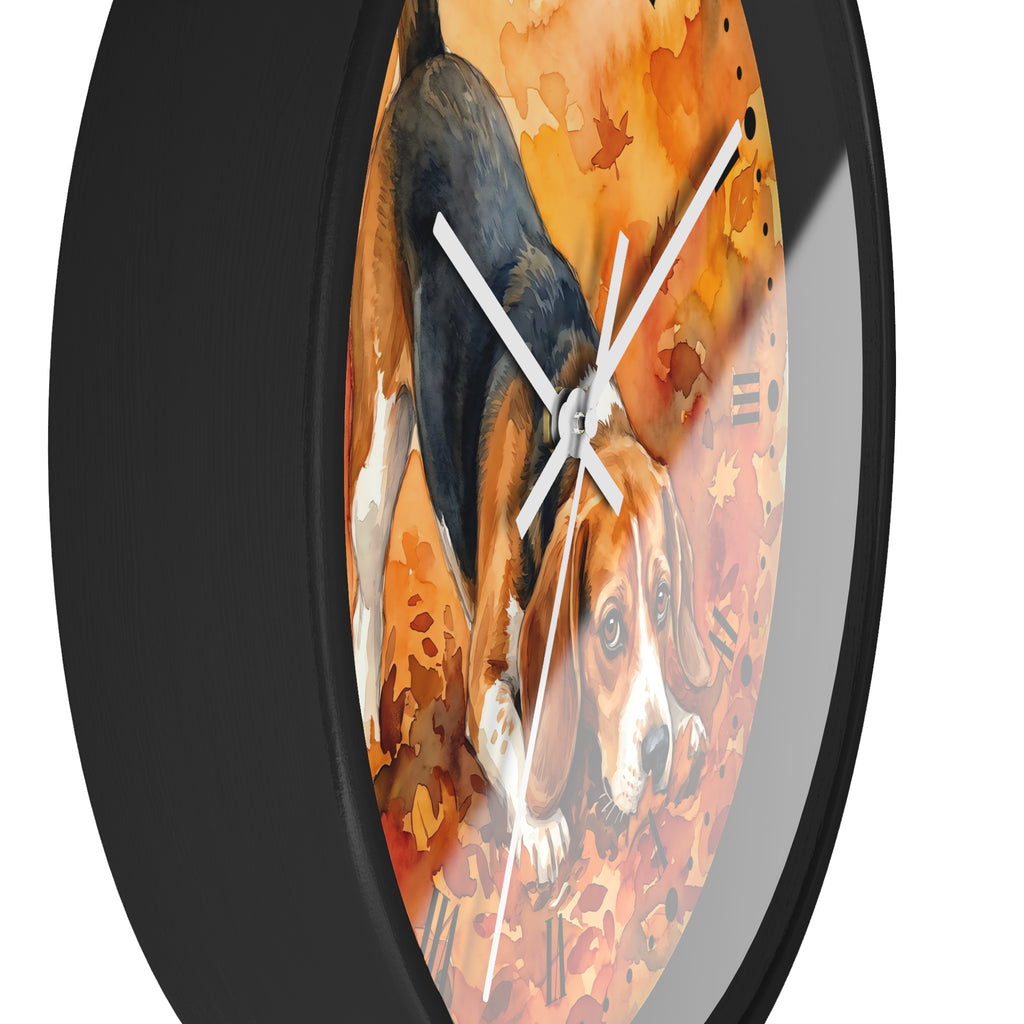 Round wall clock with a black frame and a printed illustration of a beagle dog among orange autumn leaves on the face, shown against a white background.