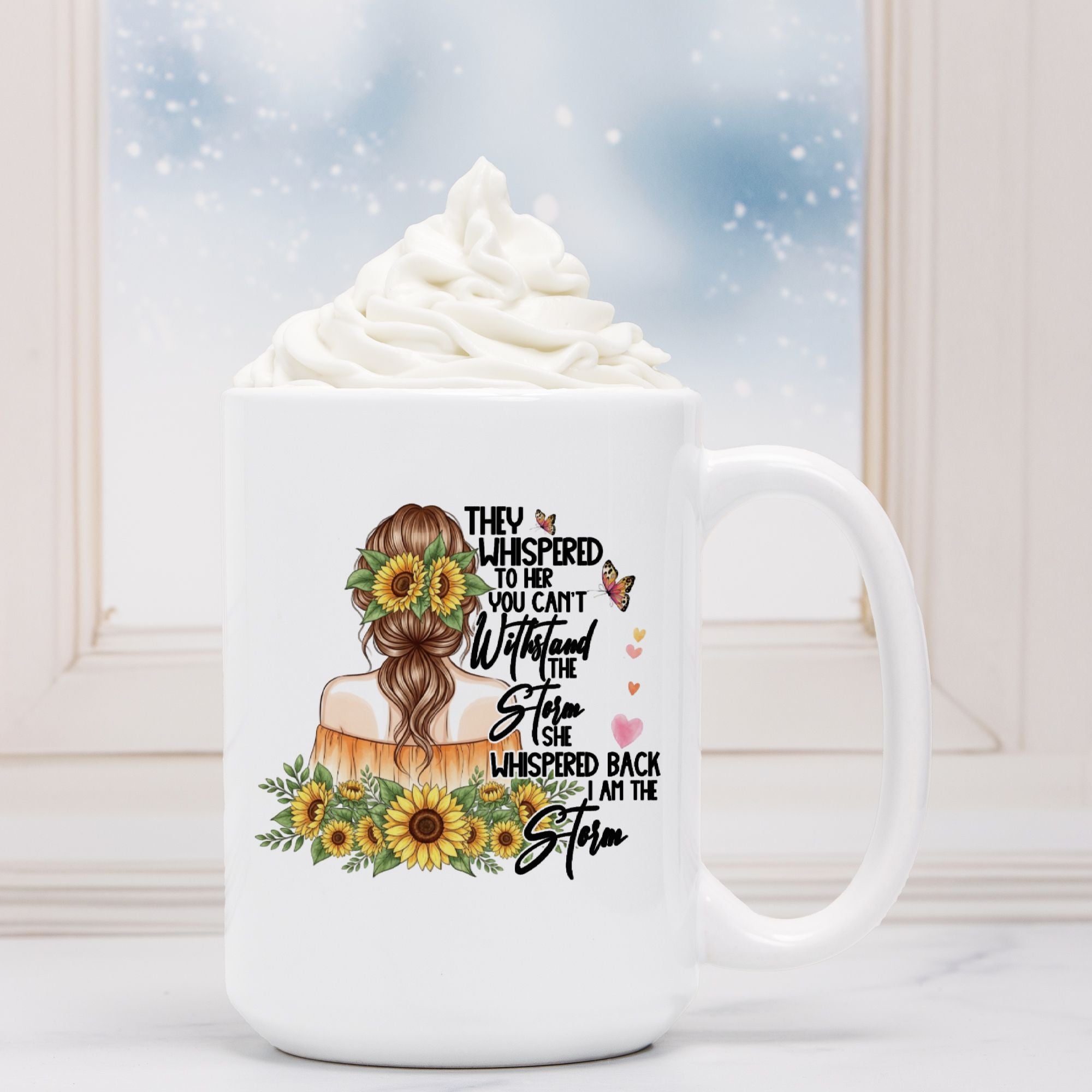 White mug with a design of a woman's head, sunflowers, and text on a white background.
