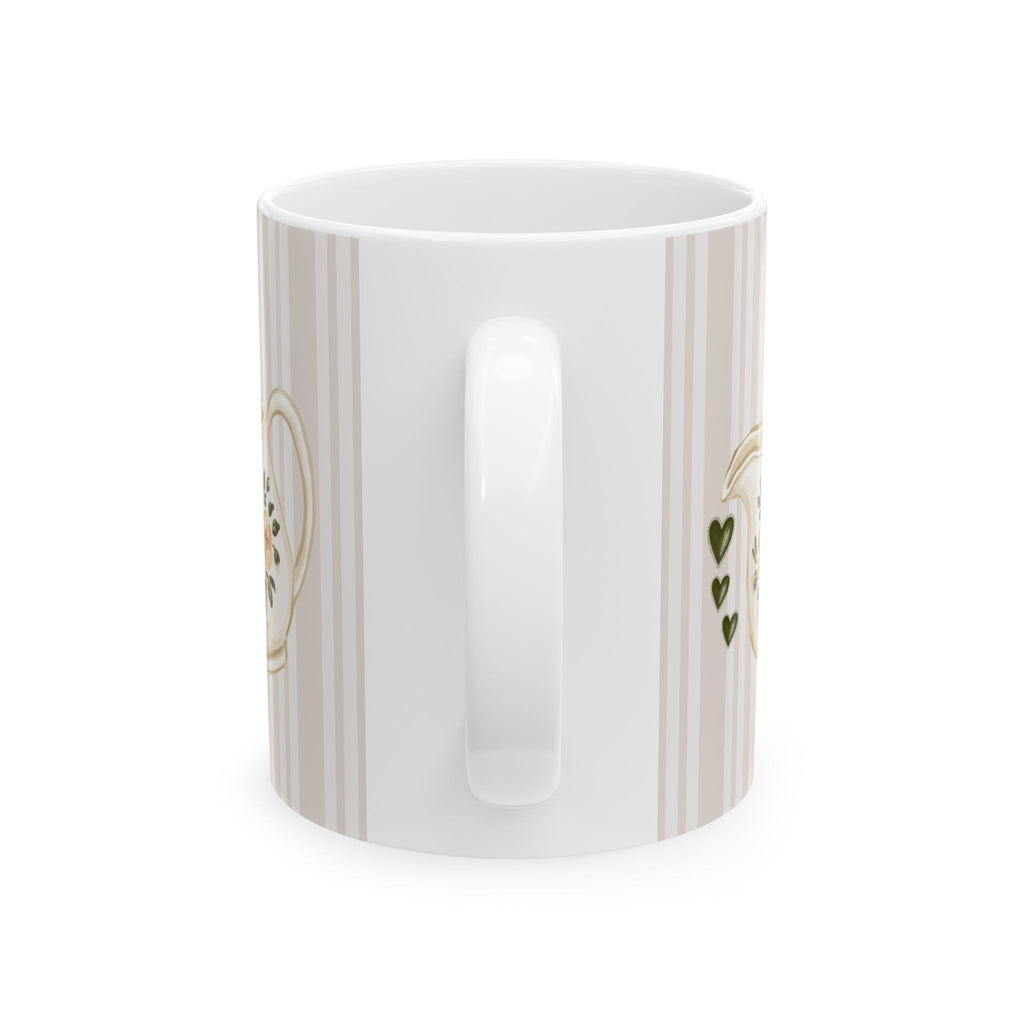 A white ceramic mug with a vertical striped pattern in beige and white, featuring gold and green decorative accents on the sides, shown against a plain white background.