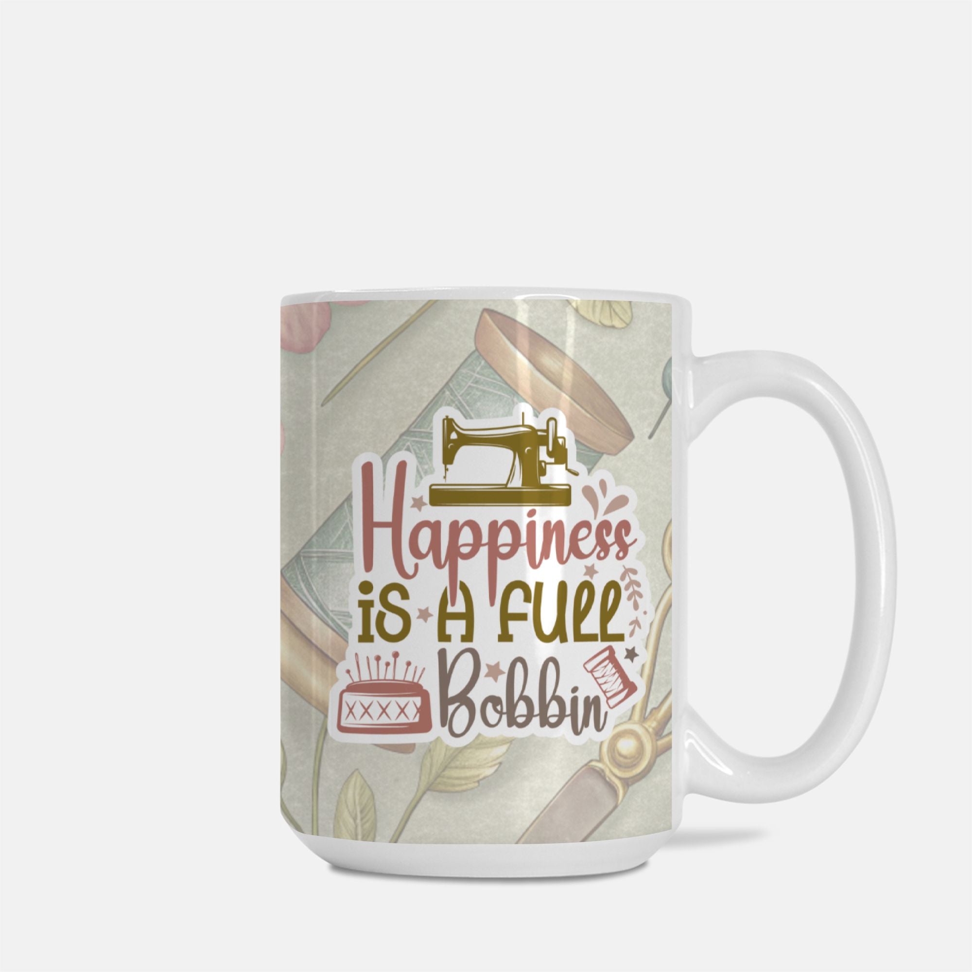 Mug with sewing-themed design and text 'Happiness is a full bobbin' on a light background