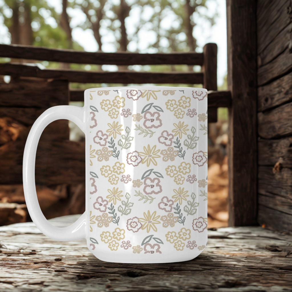 White mug with floral pattern on a wooden surface outdoors