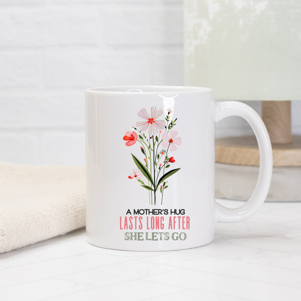 White 11oz mug with floral design and text on a light background