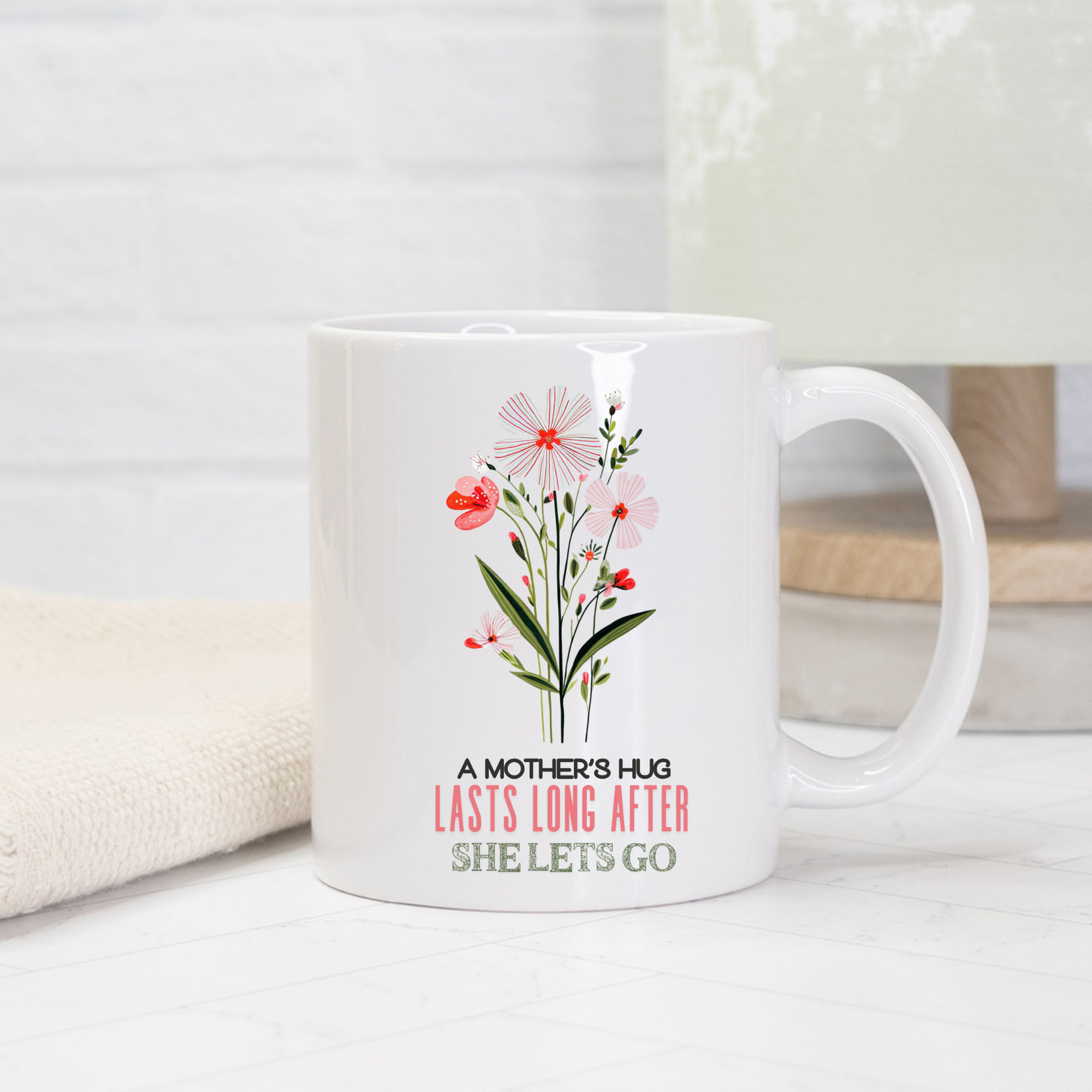 White 11oz mug with floral design and text on a light background