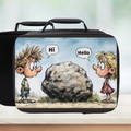 Black lunch bag with cartoon design of two children and a rock on a blurred background