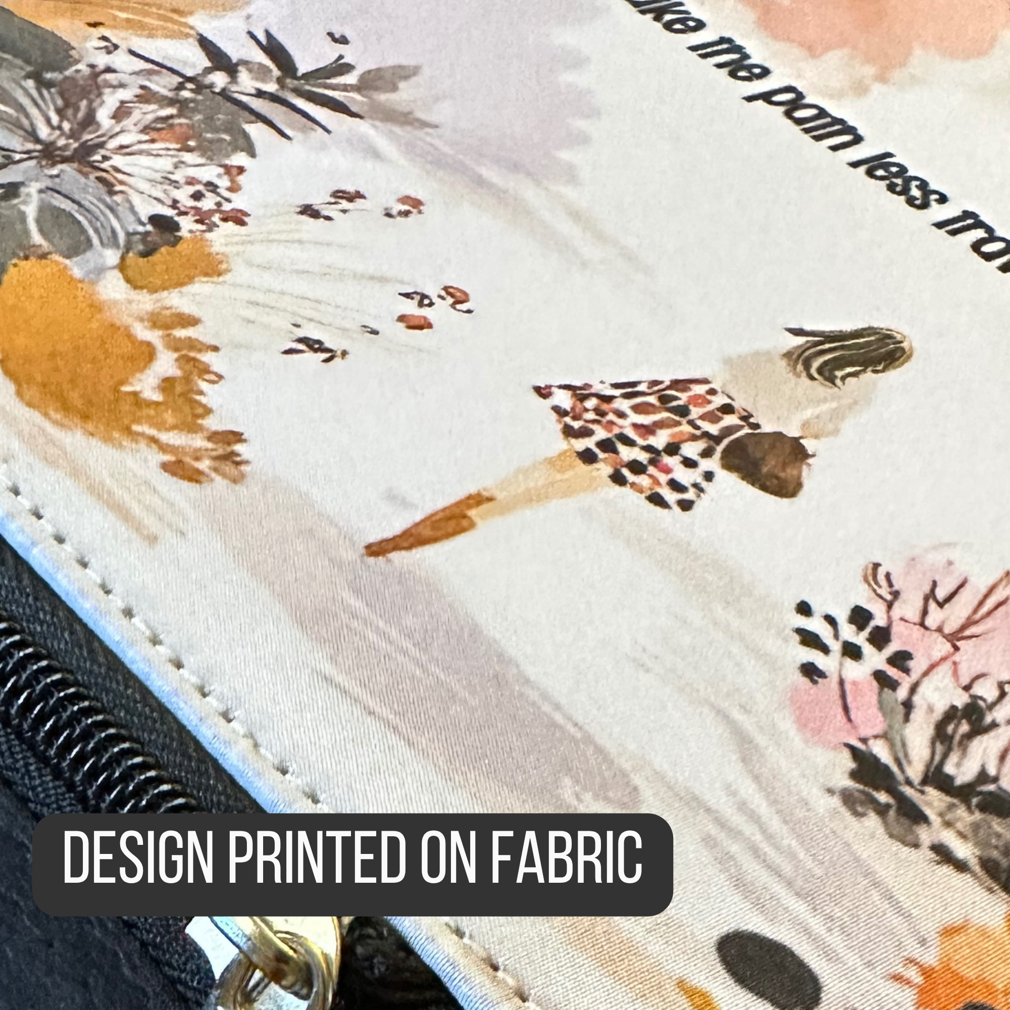 Close-up of fabric of an insulated lunch bag with a design printed on it, featuring a person in a dress and floral elements. Labeled 'Design Printed On Fabric'.