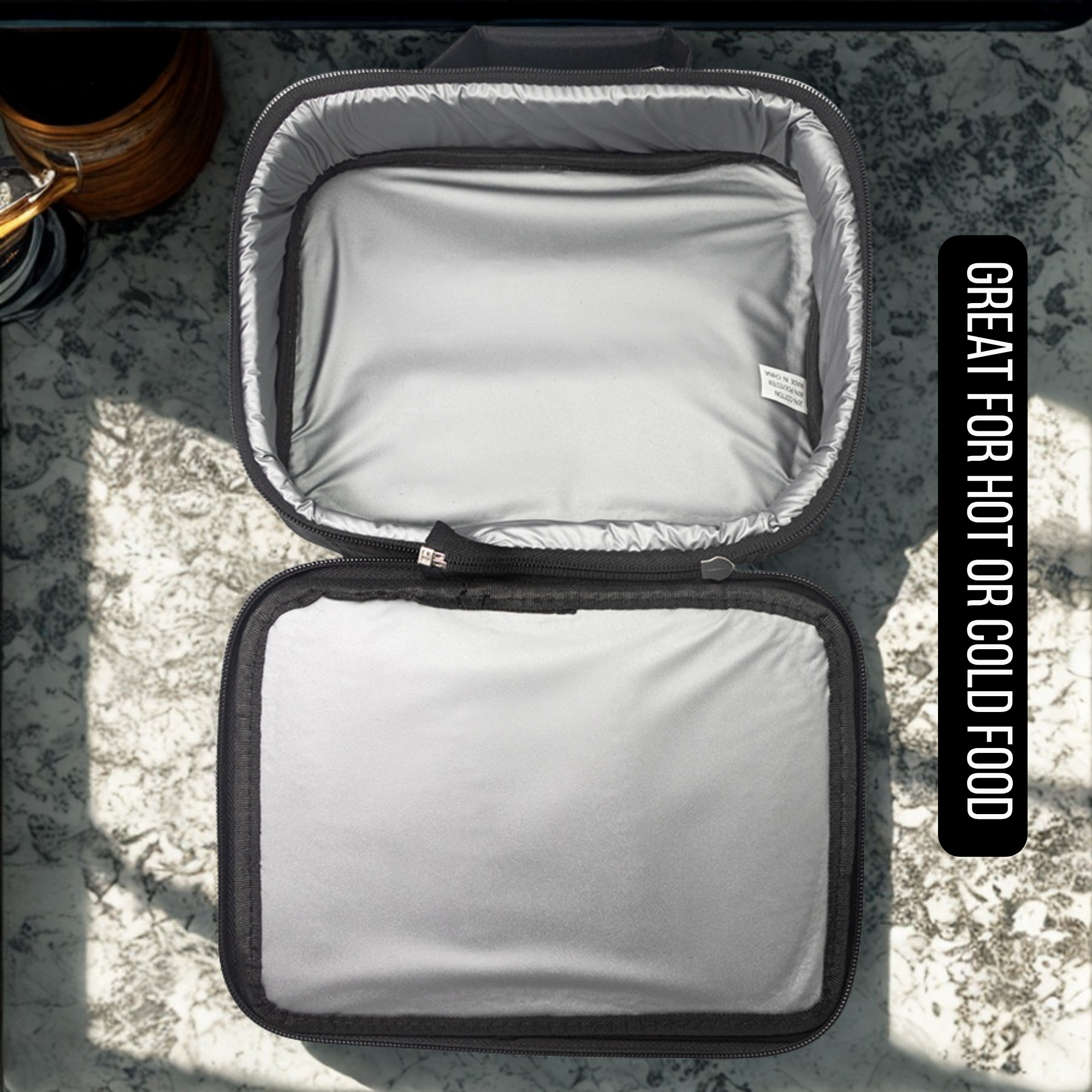 Open Insulated lunch bag with text 'Great for hot or cold food' on a textured surface.