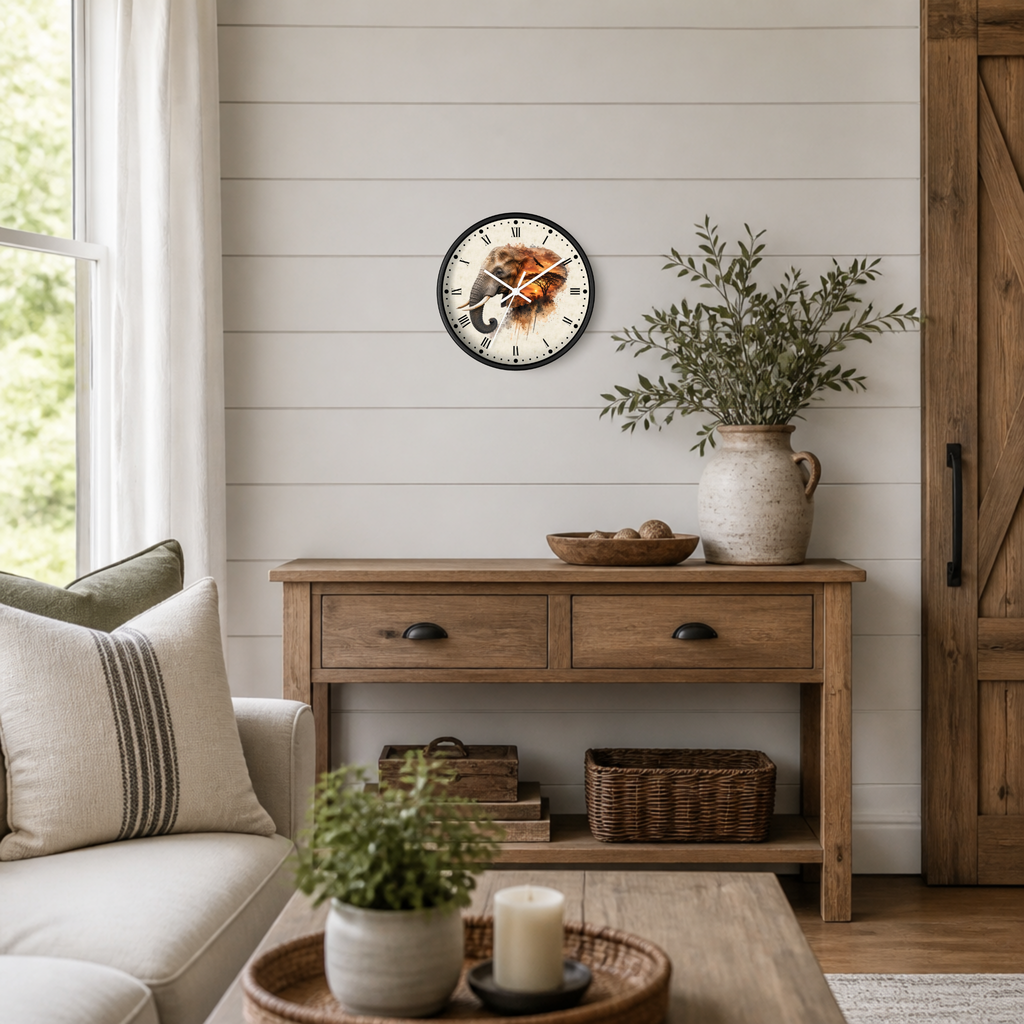 A round wall clock with a black frame and a rustic elephant design on a white shiplap wall above a wooden console table in a bright, modern farmhouse living room.