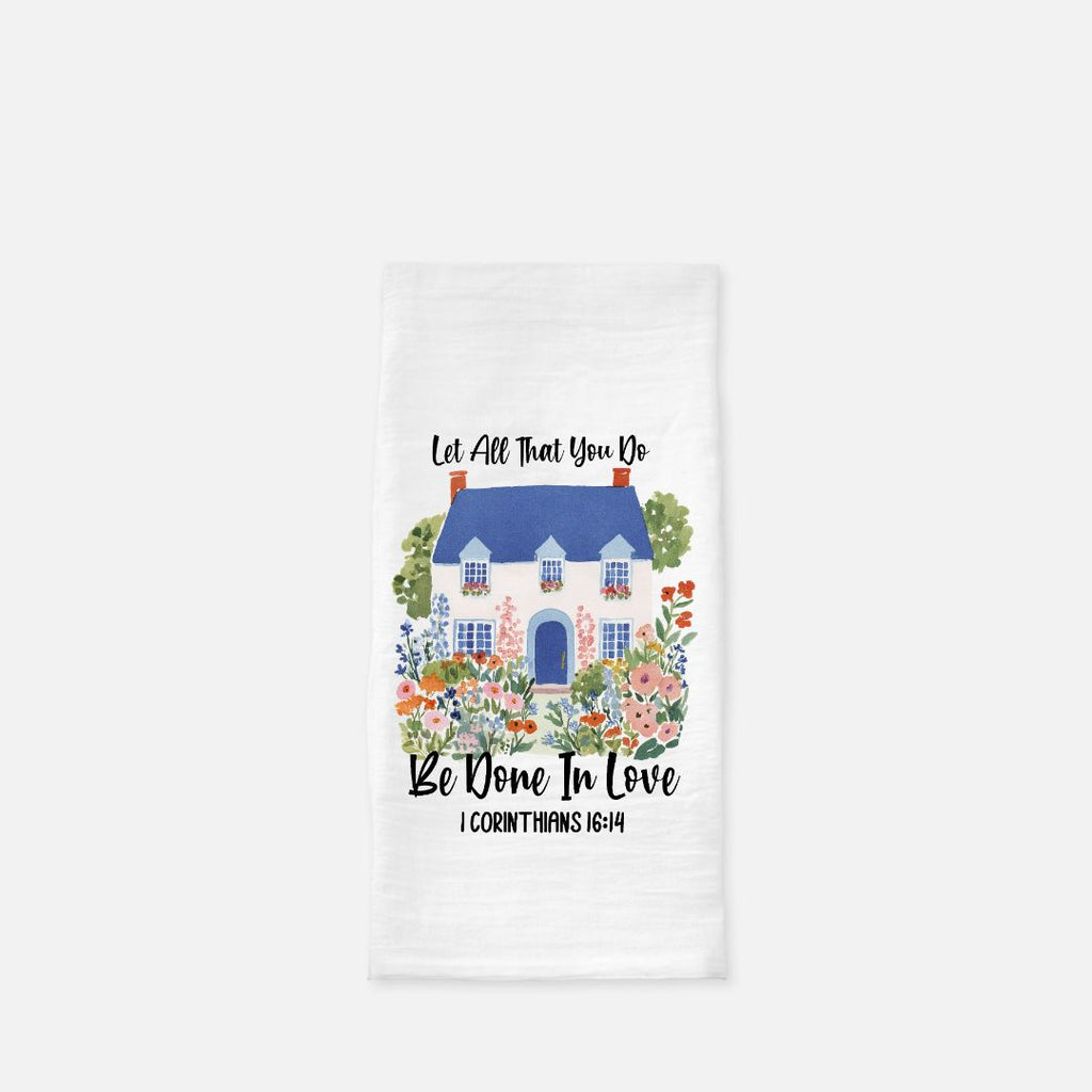Decorative towel with a house illustration and scripture quote text on a white background