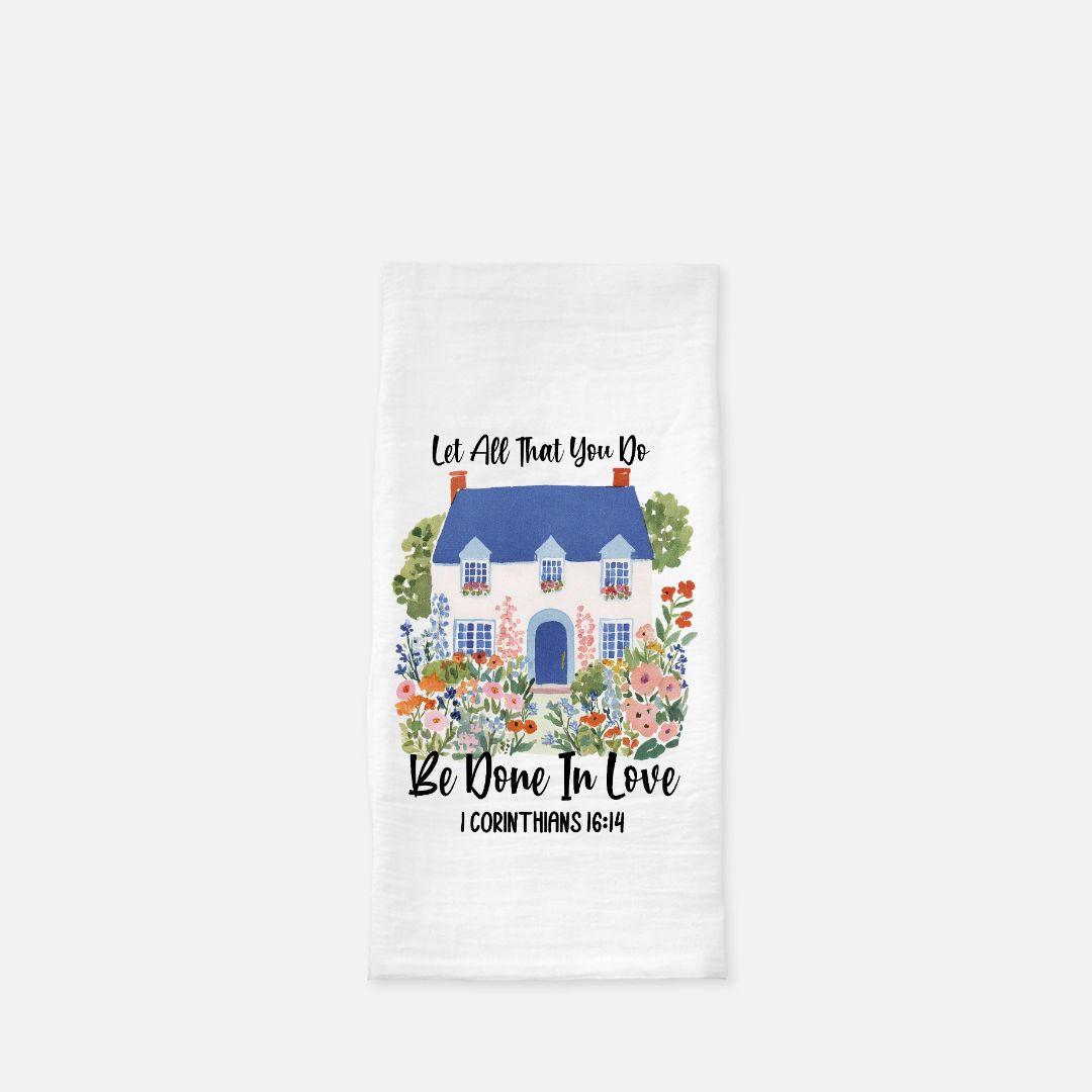 Decorative towel with a house illustration and scripture quote text on a white background