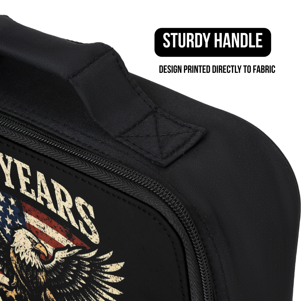 Black lunch bag with American flag and eagle design, sturdy handle, and text on a white background