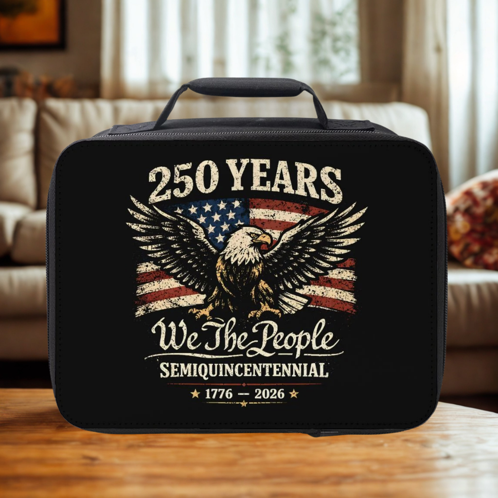 Black lunch bag with eagle and American flag design on a wooden table in a cozy living room.