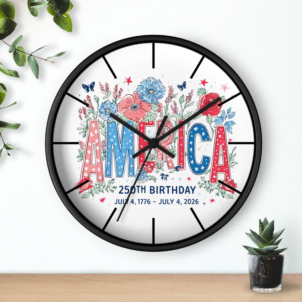 Round black decorative wall clock with 'America' and floral design on a white background