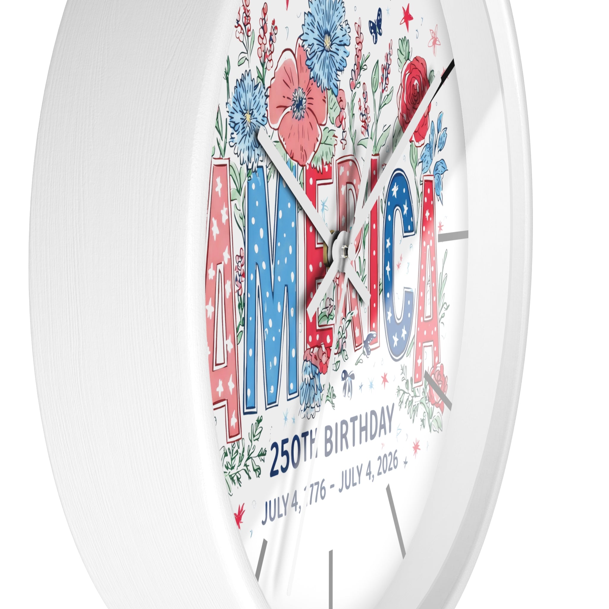 Side view of a white decorative clock with 'AMERICA' and floral design on a white background